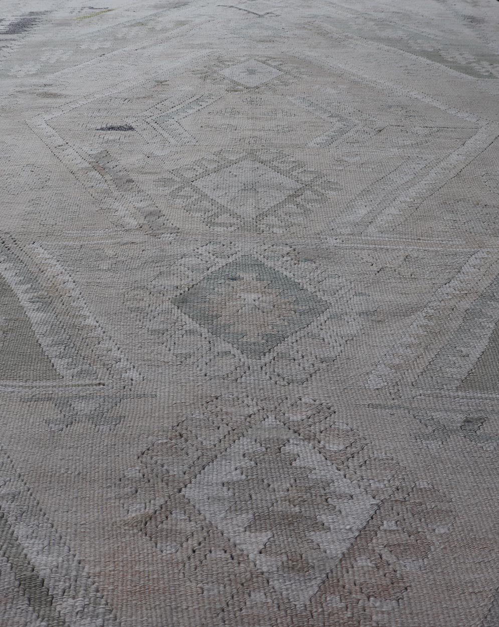 Vintage Hand - Woven Turkish Kilim in Wool with Medallion Sub - Geometric Design This flat - weave tribal Turkish kilim has been hand - woven in wool. The rug features an all - over sub - geometric medallion design, rendered in greens, blues and neutra... - Keivan Woven ArtsEN - 13963 - 19496