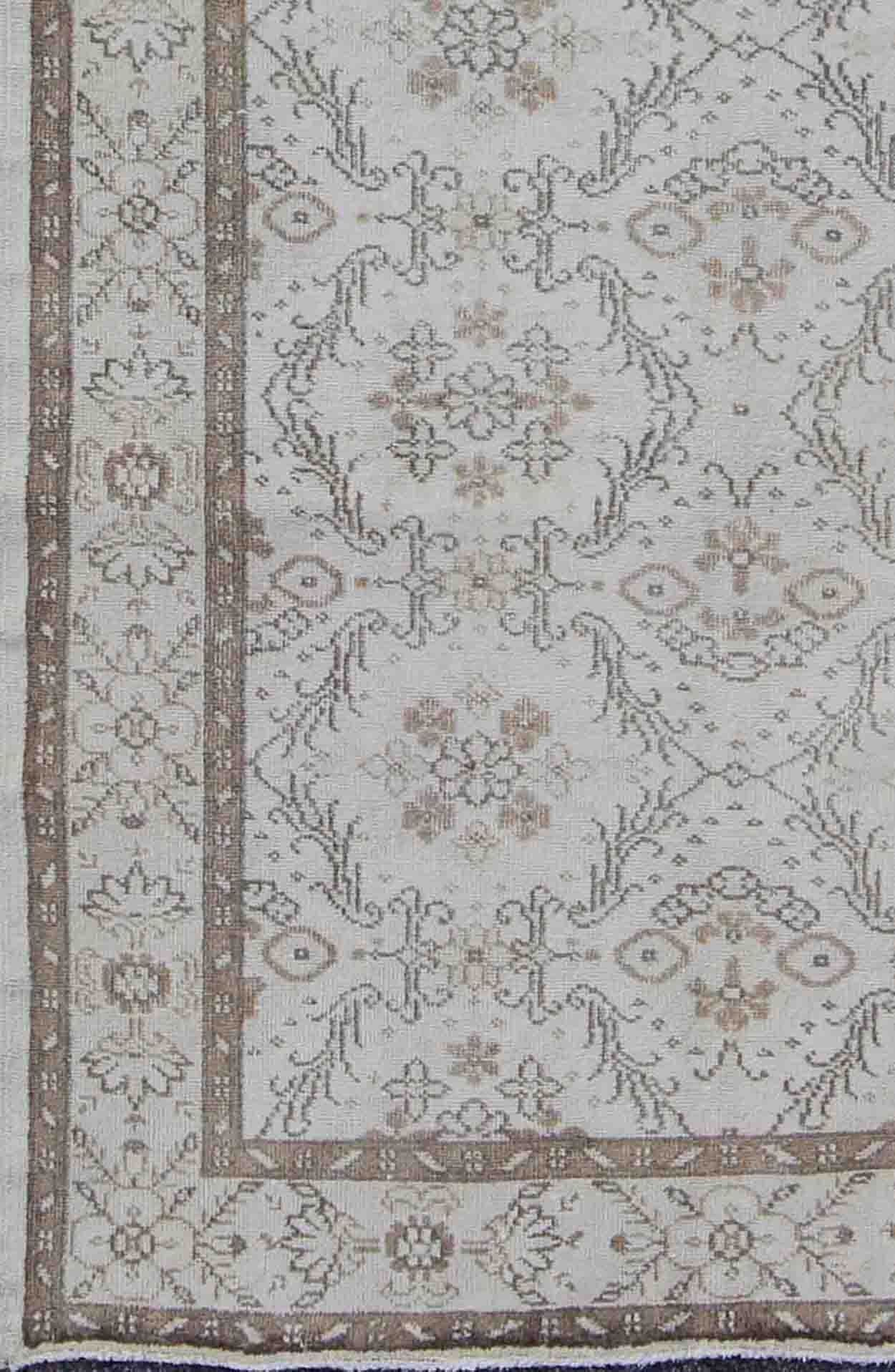 Vintage Turkish Oushak Carpet with Ivory Ground and Repeating Floral Design. Keivan Woven Arts / circa/1940 rug/ EN - 140436 Mid - 20th Century Vintage Oushak. Measures: 5'2 x 8'9. The design of this beautiful vintage Oushak rug from mid - 20th centu... - Keivan Woven ArtsEN - 140436 - 5664Rug