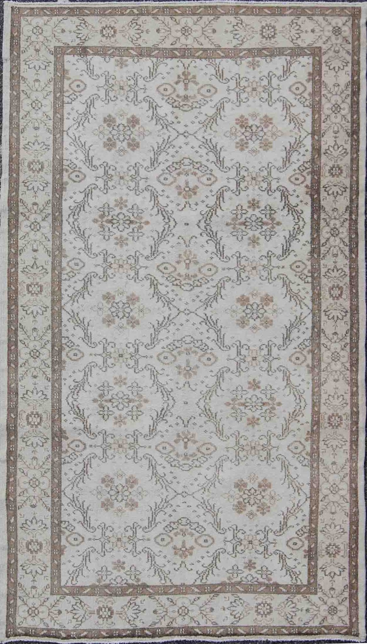 Vintage Turkish Oushak Carpet with Ivory Ground and Repeating Floral Design. Keivan Woven Arts / circa/1940 rug/ EN - 140436 Mid - 20th Century Vintage Oushak. Measures: 5'2 x 8'9. The design of this beautiful vintage Oushak rug from mid - 20th centu... - Keivan Woven ArtsEN - 140436 - 5664Rug