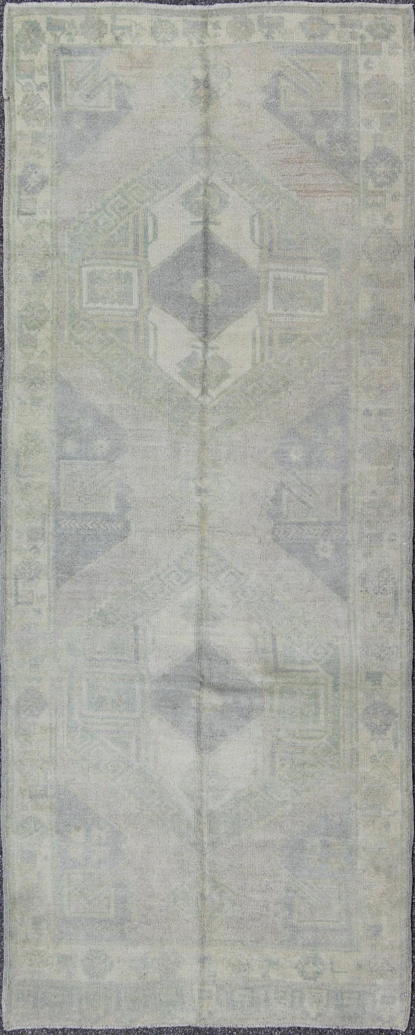 Muted Turkish Oushak Carpet with Two Diamond Medallions in Blue and Gray This Turkish Oushak carpet features a design with two central medallions, as well as patterns of smaller all - over diamonds and scattered sprays of vine scroll and palmettes... - Keivan Woven ArtsEN - 140440 - 6362Rug