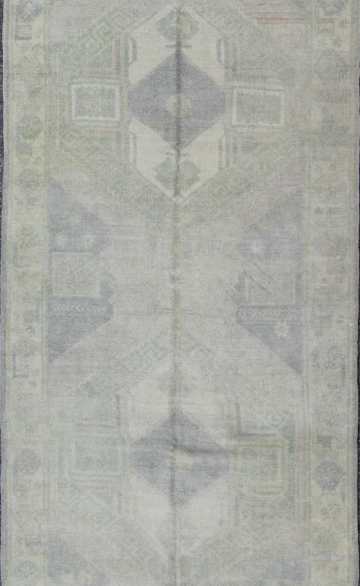 Muted Turkish Oushak Carpet with Two Diamond Medallions in Blue and Gray This Turkish Oushak carpet features a design with two central medallions, as well as patterns of smaller all - over diamonds and scattered sprays of vine scroll and palmettes... - Keivan Woven ArtsEN - 140440 - 6362Rug