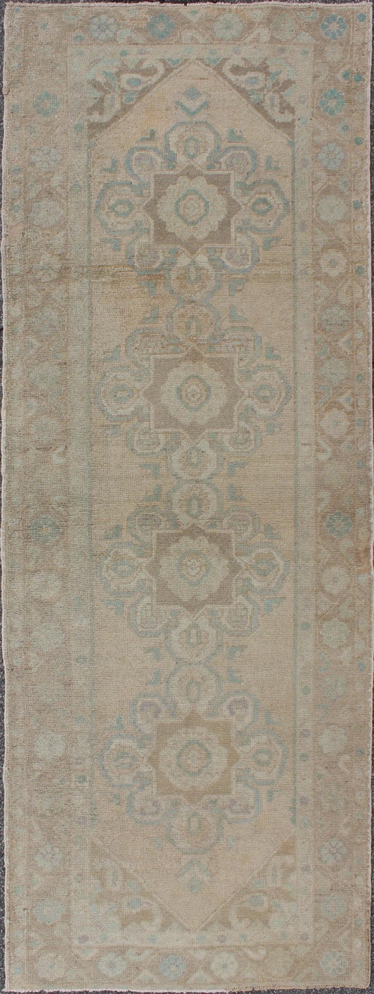Floral medallion vintage Turkish Oushak runner with faded color palette, rug en - 140461, country of origin / type: Turkey / Oushak, circa 1930 This vintage Turkish Oushak gallery rug (1930) features a unique blend of colors and an intricately bea... - Keivan Woven ArtsEN - 140461 - 6049Rug