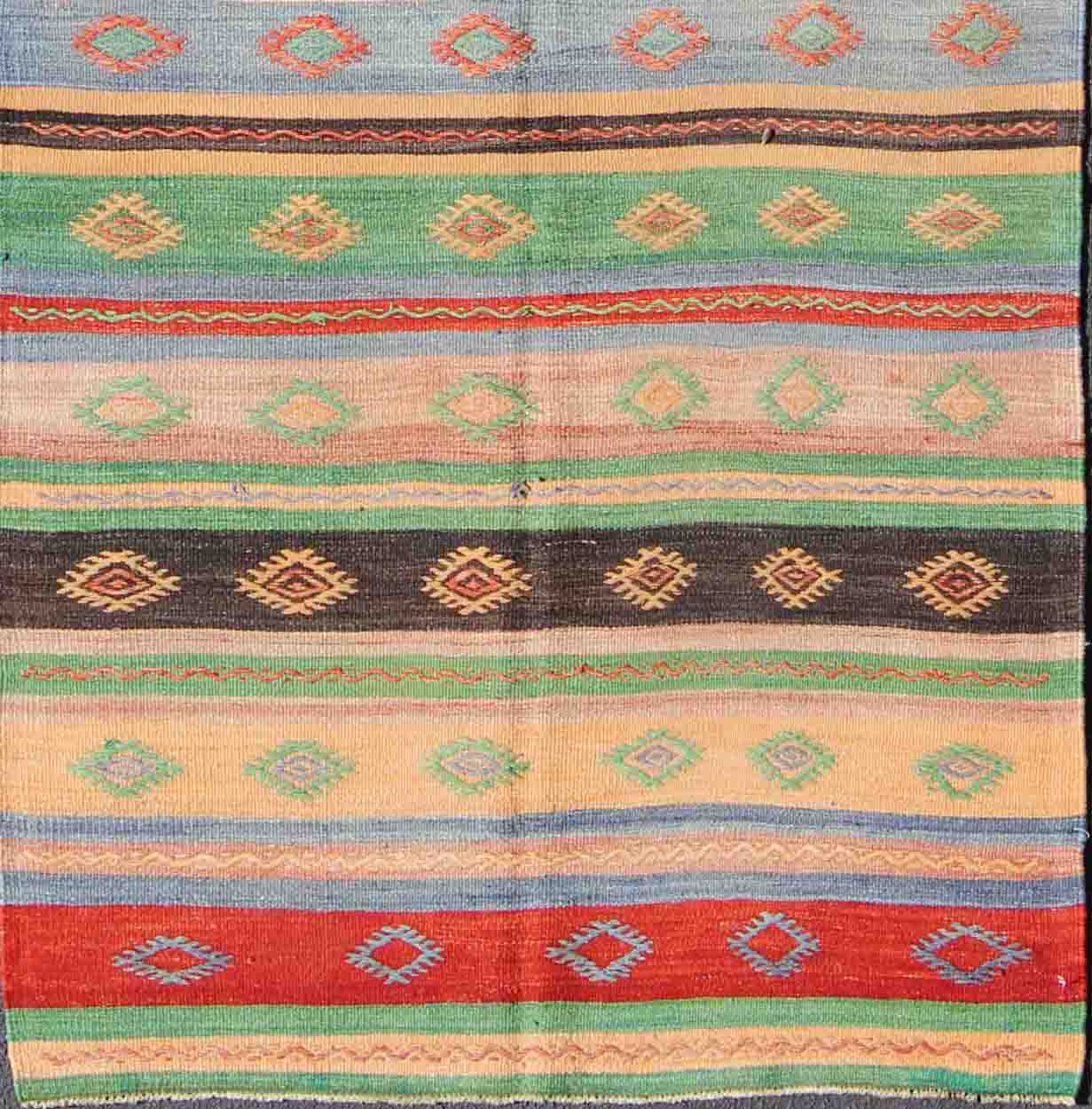 Vintage Turkish Kilim Carpet with Colorful Geometric Stripe Design. Vintage Hand - Knotted Turkish Kilim with Geometric Stripes, rug EN - 140519, country of origin / type: Turkey / Oushak, circa mid - 20th century. Featuring tribal shapes with a sp... - Keivan Woven ArtsEN - 140519 - 6061Rug