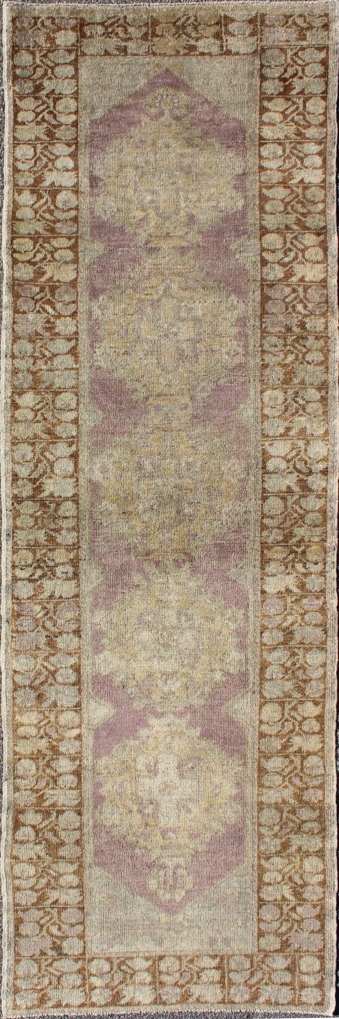 Vintage Oushak Runner This unique Turkish Oushak runner displays an elegant multi floral medallions which are complemented by a Sub geometric border. This rug has light purple background with dark brown, light blue, cream, green and taupe. Me... - Keivan Woven ArtsEN - 140539 - 6077Rug