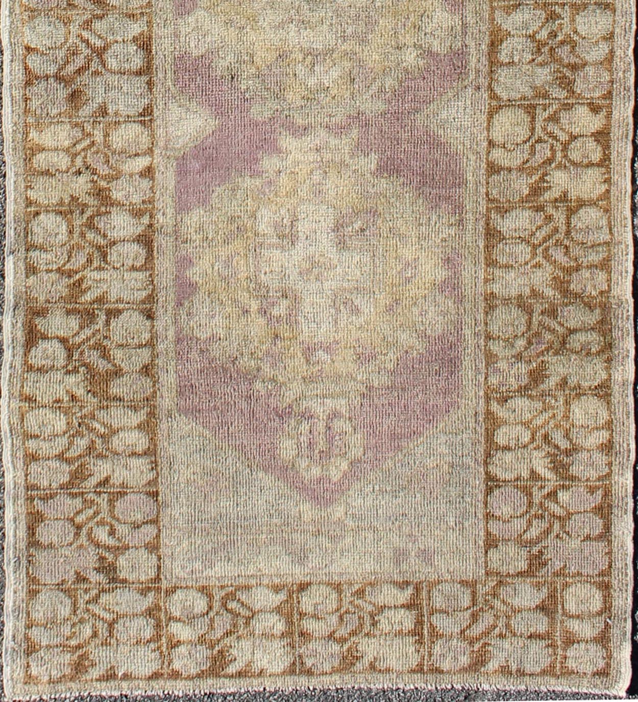 Vintage Oushak Runner This unique Turkish Oushak runner displays an elegant multi floral medallions which are complemented by a Sub geometric border. This rug has light purple background with dark brown, light blue, cream, green and taupe. Me... - Keivan Woven ArtsEN - 140539 - 6077Rug