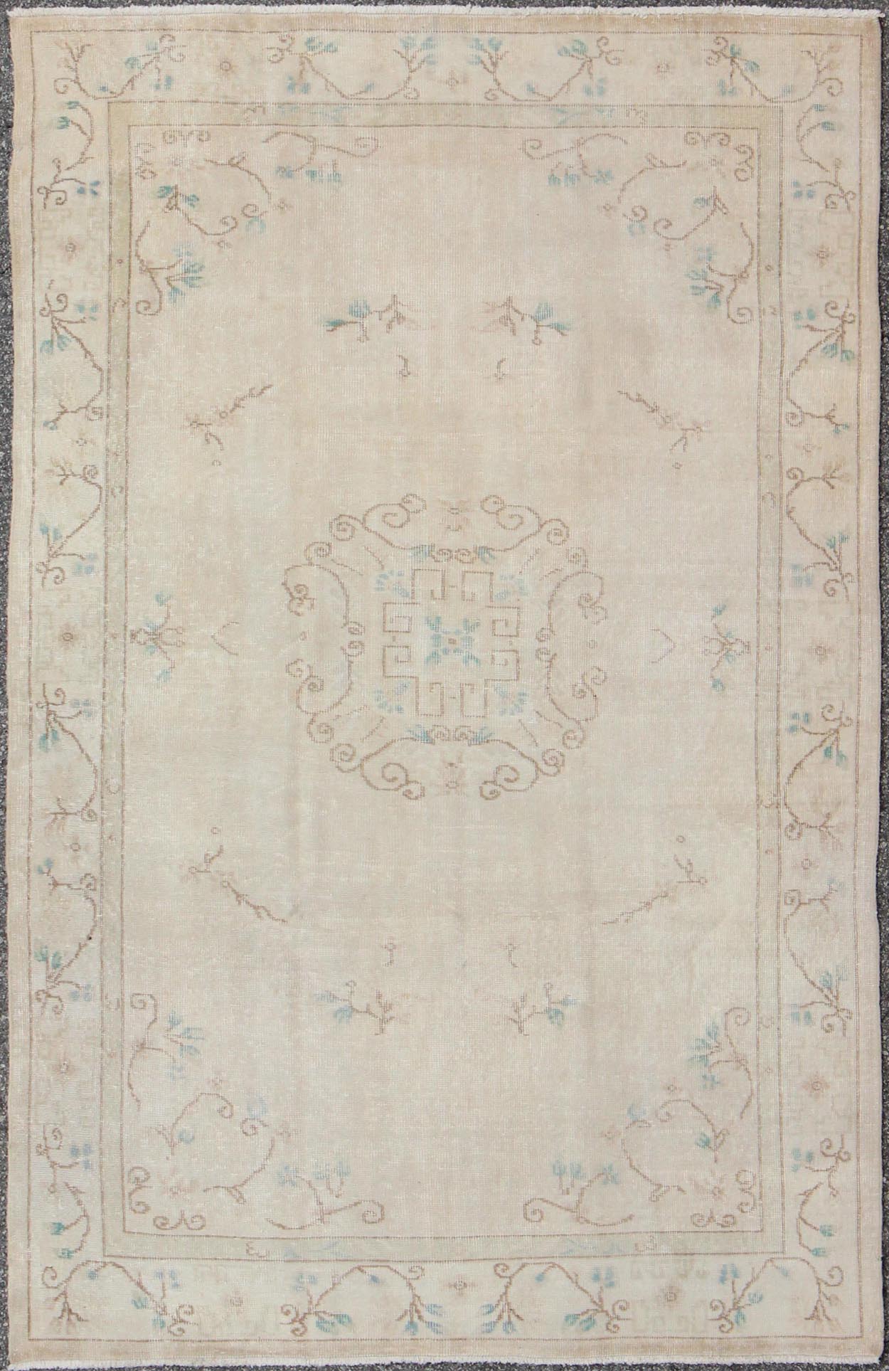 Vintage Khotan Design Rug in Neutrals, Cream, Light Blue, Light Brown & Colors with small circular medallion in buff and cream background with Neutral Colors, Light Blue, Light Brown. Keivan Woven Arts /rug EN - 140565 , country of origin / type: Turkey ... - Keivan Woven ArtsEN - 140565 - 5696Rug
