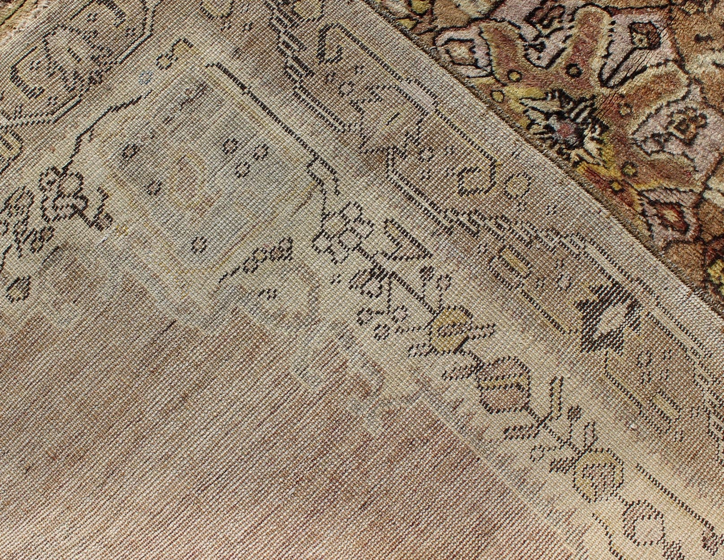 This vintage Turkish Oushak rug features an intricately beautiful design with a stylized floral aesthetic. The central medallion is surrounded by four cornices in the central field. The various shades of cream, yellow, charcoal, and gray blend beautifu... - Keivan Woven ArtsEN - 140587 - 6374Rug