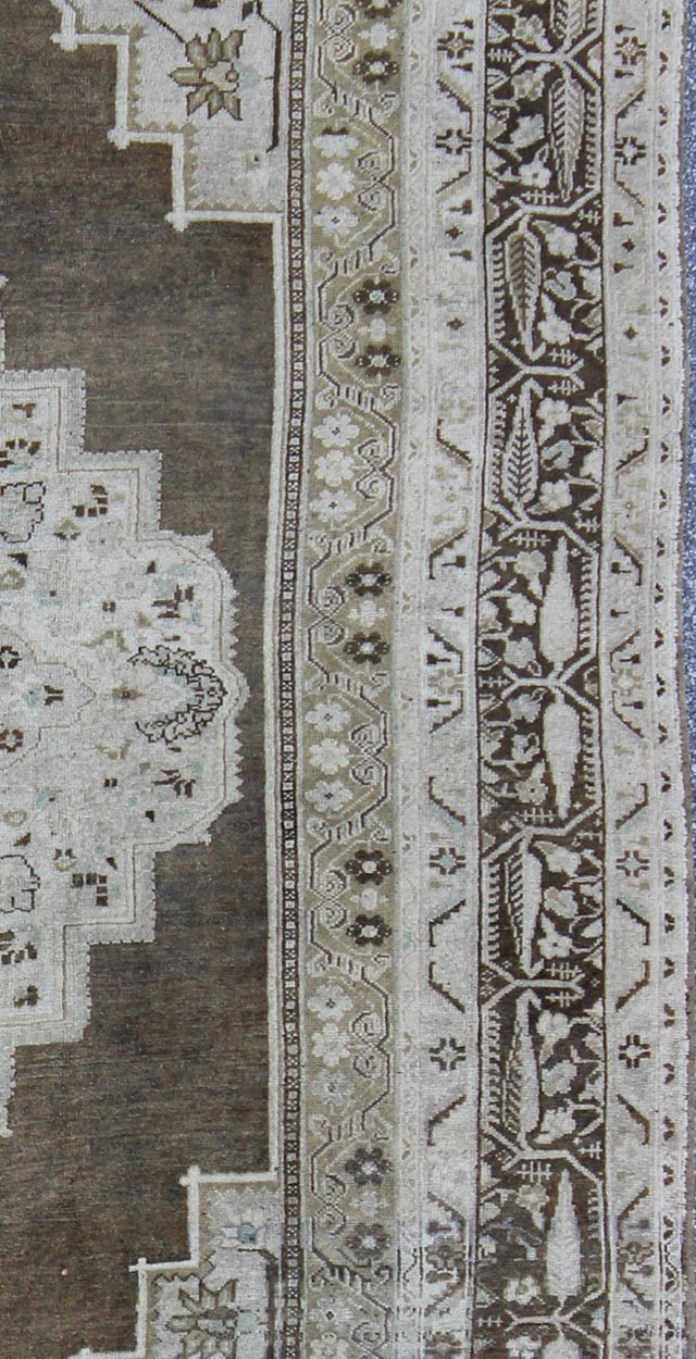 Vintage Turkish Oushak long Rug with Medallion in Brown, Green & Neutral Colors Measures: 7'7 x 12'2 This beautiful Turkish Oushak from mid 20th century Turkey features a Classic medallion Oushak design. The Greenish - brown ground is home ... - Keivan Woven ArtsEN - 140878 - 6638Rug