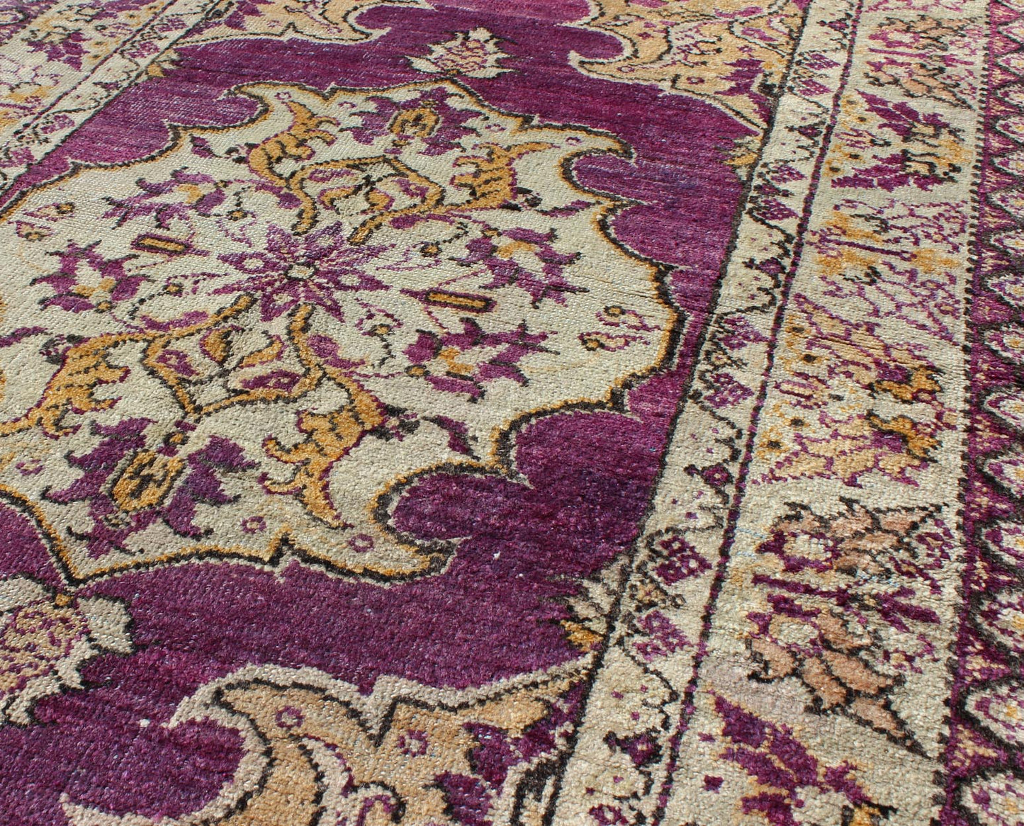 Purple Vintage Turkish Oushak Rug with a Traditional Medallion Design Measures: 3'6'' x 5'8''. This lovely vintage Oushak is set on a purple background and features a floral medallion with accents of deep gold. The taupe border has a unique ... - Keivan Woven ArtsEN - 141034 - 7135Rug