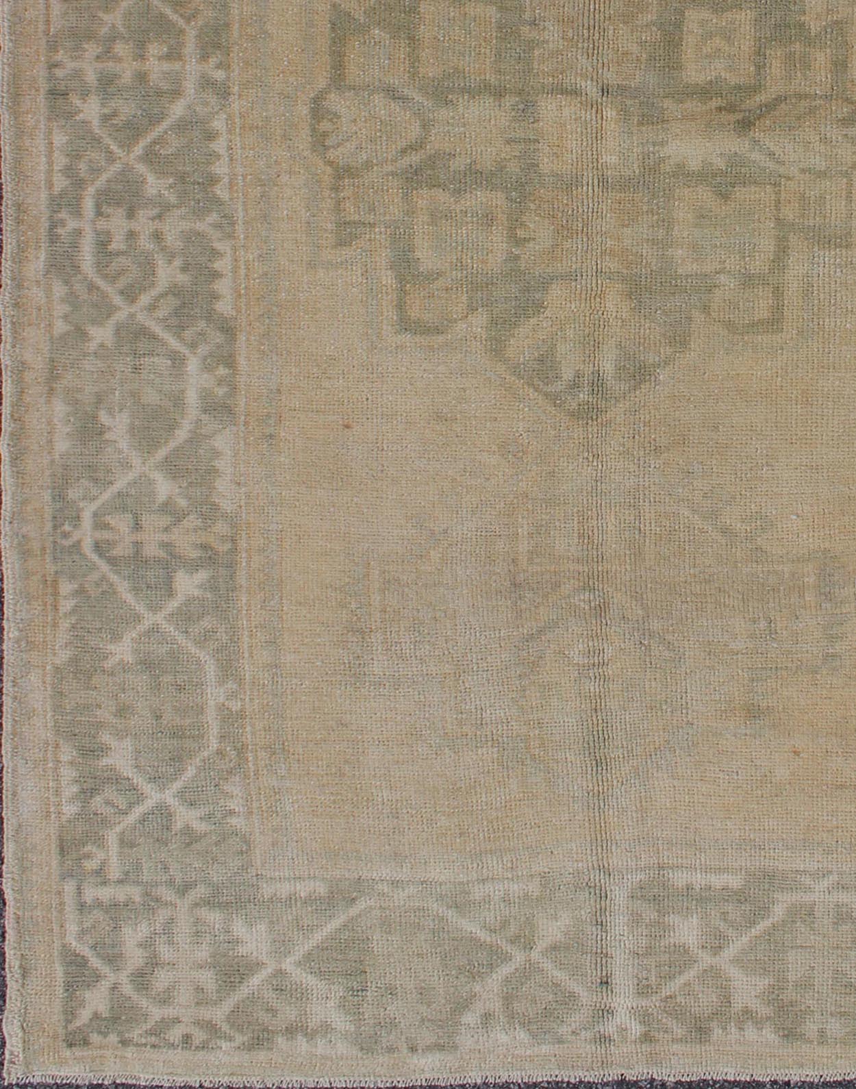 Medallion Vintage Turkish Oushak Rug in Taupe, Green and Sand Colors This vintage Turkish Oushak rug (circa mid - 20th century) features a unique blend of colors and an intricately beautiful design. The central three medallions, two more faint tha... - Keivan Woven ArtsEN - 141655 - 6710Rug