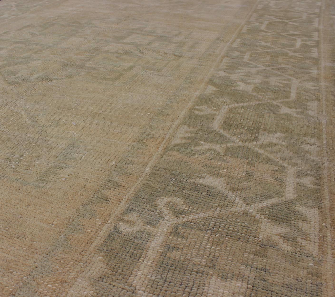 Medallion Vintage Turkish Oushak Rug in Taupe, Green and Sand Colors This vintage Turkish Oushak rug (circa mid - 20th century) features a unique blend of colors and an intricately beautiful design. The central three medallions, two more faint tha... - Keivan Woven ArtsEN - 141655 - 6710Rug