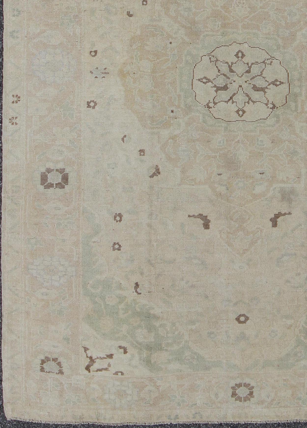Muted Turkish Oushak Rug With Medallion in Shades of Taupe, Light Brown & Green. Muted Turkish Oushak rug with medallion design and floral pattern. rug en - 141693, country of origin / type: Turkey / Oushak, circa mid - 20th century This Tur... - Keivan Woven ArtsEN - 141693 - 6731Rug