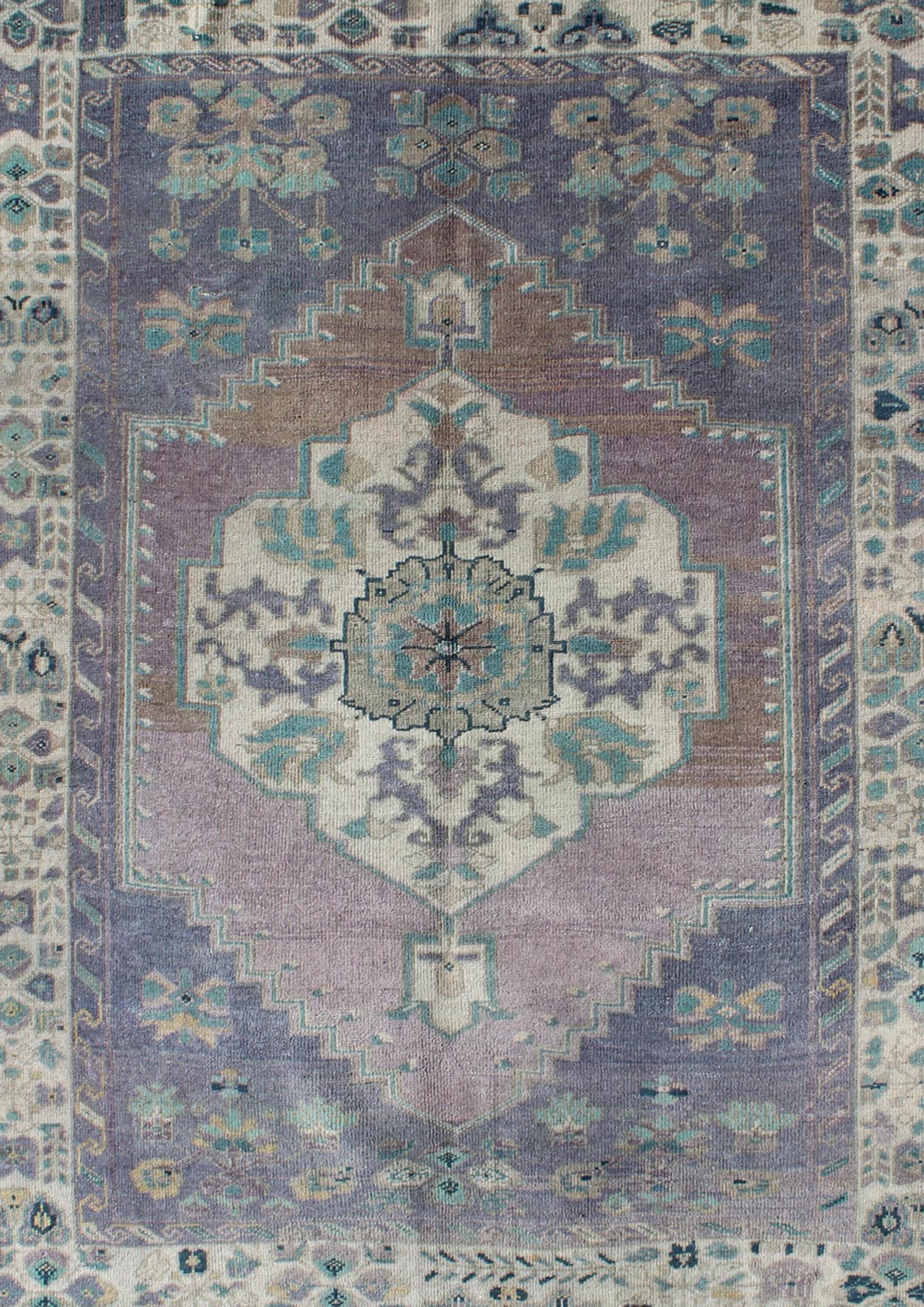 Purple and Teal Vintage Turkish Oushak Rug with Floral Layered Medallion Design Measures: 5'0 x 6'6''. This vintage Turkish Oushak rug features an intricately beautiful design with a floral aesthetic. The central medallion is surrounded by mu... - Keivan Woven ArtsEN - 141744 - 6769Rug