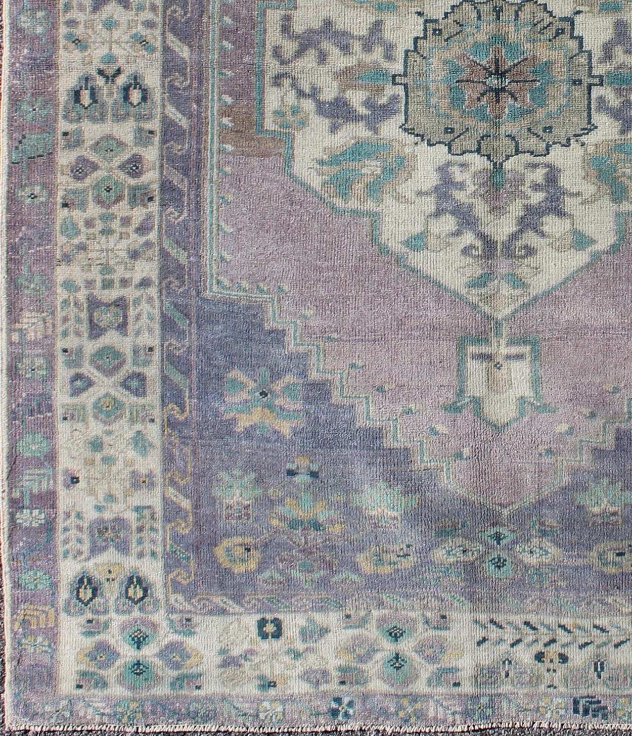 Purple and Teal Vintage Turkish Oushak Rug with Floral Layered Medallion Design Measures: 5'0 x 6'6''. This vintage Turkish Oushak rug features an intricately beautiful design with a floral aesthetic. The central medallion is surrounded by mu... - Keivan Woven ArtsEN - 141744 - 6769Rug