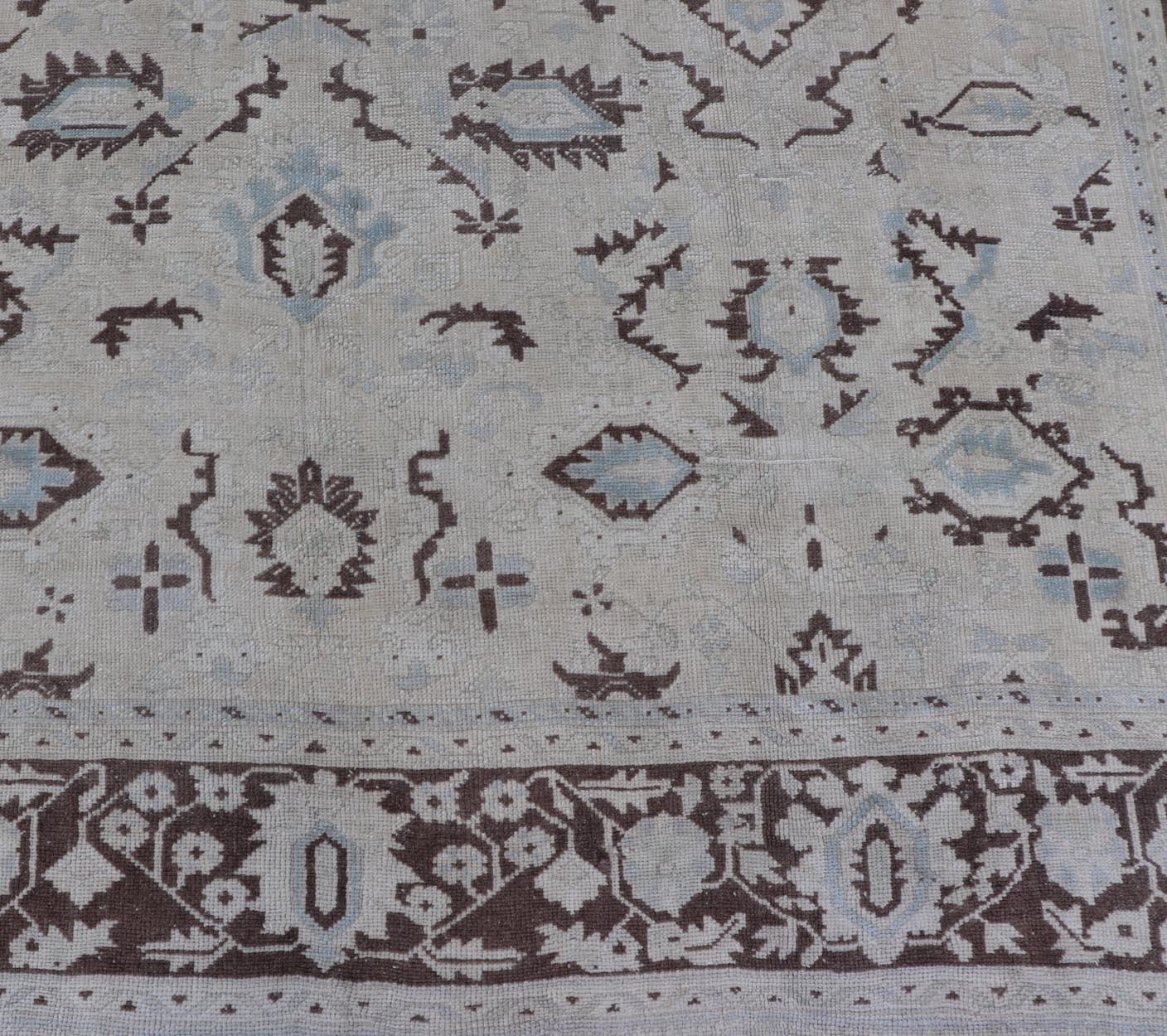 Square Shaped Vintage Turkish Oushak Rug with Brown, Lt. Blue and Cream Tones Keivan Woven Arts / rug EN - 141954, country of origin / type: Turkey / Oushak, circa mid - 20th Century. Measures: 11'0'' x 12'5''. This vintage Turkish Oushak rug from th... - Keivan Woven ArtsEN - 141954 - 7835Rug