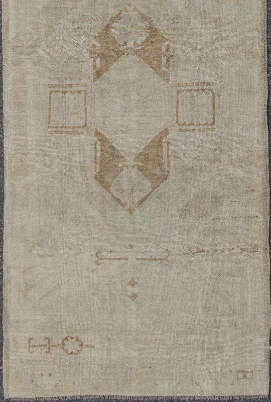 Vintage Oushak Turkish Runner with Ivory, Taupe and Light Brown and Faint Green Measures: 3'4'' x 11'8''. This beautiful vintage Oushak runner from mid - 20th century Turkey features a classic geometric Oushak design. The faint ivory groun... - Keivan Woven ArtsEN - 142367 - 8052Rug