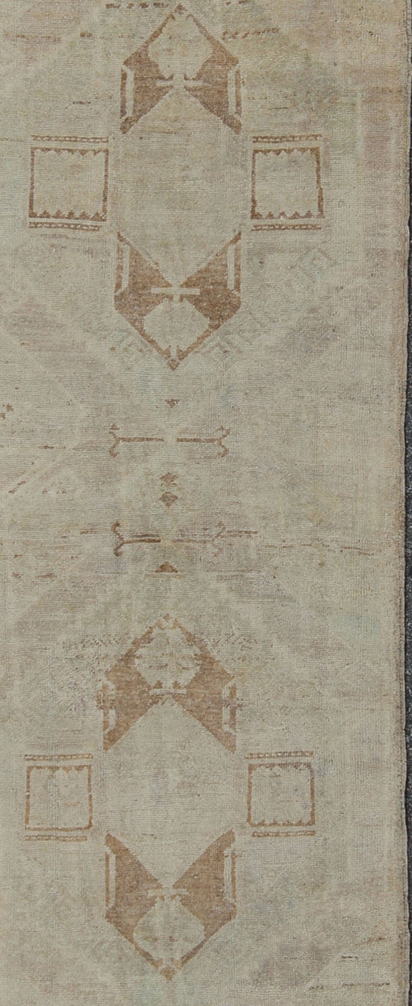 Vintage Oushak Turkish Runner with Ivory, Taupe and Light Brown and Faint Green Measures: 3'4'' x 11'8''. This beautiful vintage Oushak runner from mid - 20th century Turkey features a classic geometric Oushak design. The faint ivory groun... - Keivan Woven ArtsEN - 142367 - 8052Rug
