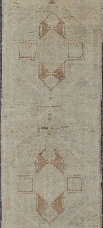 Vintage Oushak Turkish Runner with Ivory, Taupe and Light Brown and Faint Green Measures: 3'4'' x 11'8''. This beautiful vintage Oushak runner from mid - 20th century Turkey features a classic geometric Oushak design. The faint ivory groun... - Keivan Woven ArtsEN - 142367 - 8052Rug