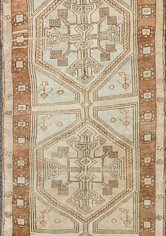 Brown, Camel, Ivory Long Turkish Oushak Runner with Geometric Tribal Medallions This vintage Turkish Oushak gallery rug (circa mid - 20th century) features a unique blend of colors and an intricately beautiful design. The central medallions consis... - Keivan Woven ArtsEN - 142368 - 8379Rug