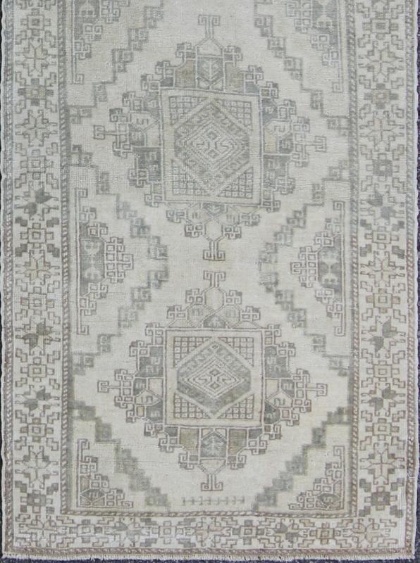 Vintage Oushak Runner with Central Medallions and Ornate Border Measures: 3'0'' x 12'3''. This beautiful vintage Oushak runner features a classic Oushak design, which is enhanced by lustrous wool. The faint ivory ground is home to six large a... - Keivan Woven ArtsEN - 142470 - 7855Rug