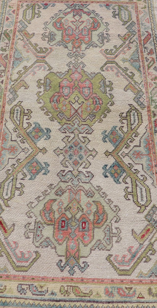 Measures: 2'10 x 5'8 Layered Medallion Vintage Turkish Area Rug Oushak with Geometric Motifs. Country of origin: Turkey; type: Oushak; design: Medallion; Keivan Woven Arts: rug EN - 14495; Layered medallion antique Turkish Oushak rug sub - geometric mo... - Keivan Woven ArtsEN - 14495 - 22782Rug
