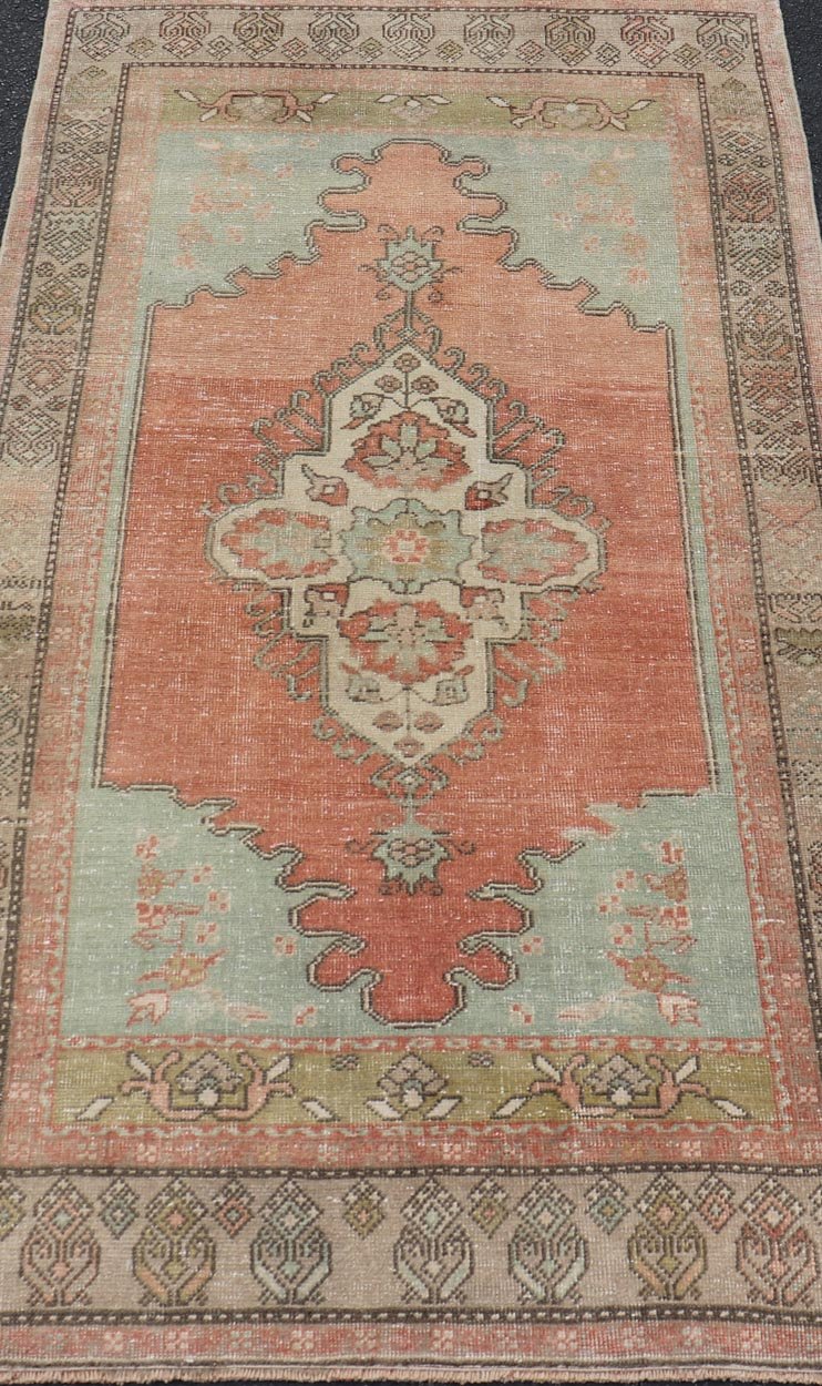 Vintage Turkish Oushak Rug With Medallion in Earthy Color Tones With Coral Color. Keivan Woven Arts / rug EN - 14597, country of origin / type: Turkey / Oushak, circa 1940 Measures: 3'2 x 5'11 This vintage Oushak carpet from Turkey has center m... - Keivan Woven ArtsEN - 14597 - 23768Rug