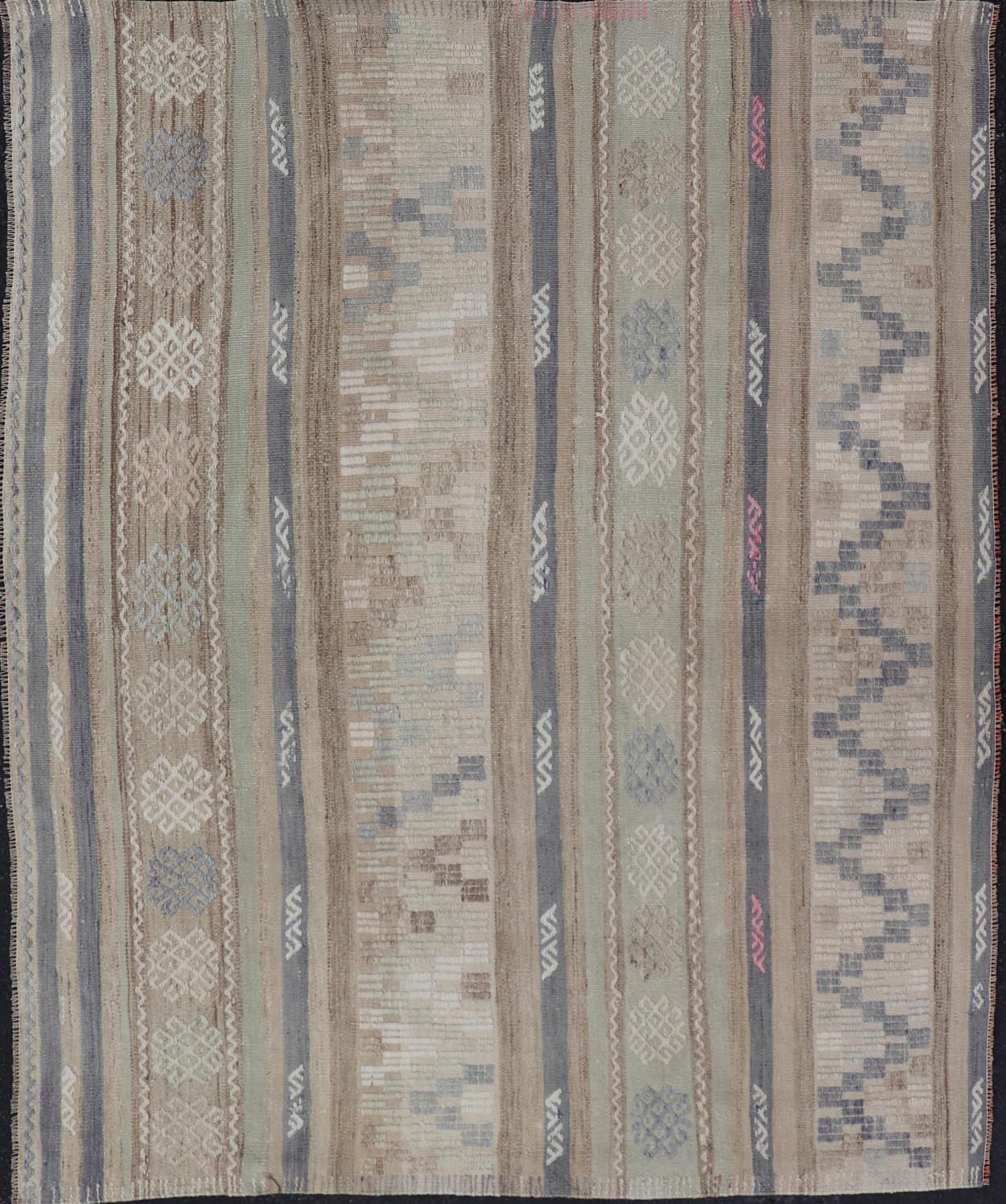 This flat - woven Kilim from Turkey features an enticing composition consisting of stripes with fascinating geometric designs rendered in natural tones of brown and gray, as well as some light green shades. Vintage Kilim with Stripes and Geometri... - Keivan Woven ArtsEN - 14668 - 23971Rug
