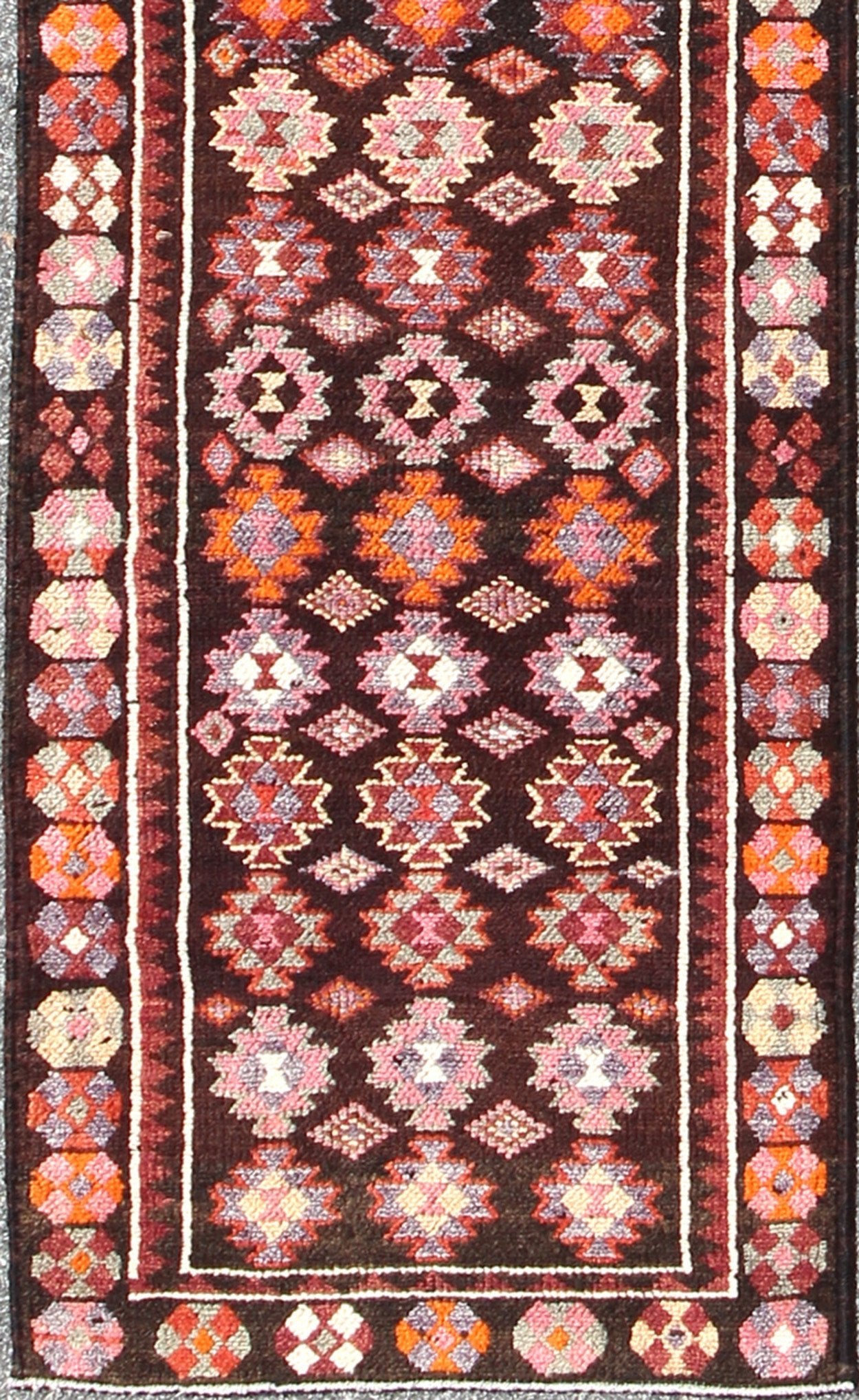 Black and Brown Background Colorful Vintage Turkish Runner with Geometric Design, rug en - 165383, country of origin / type: Turkey / Oushak, circa 1950 This vintage Turkish runner (circa mid - 20th century) features a unique blend of colors and an ... - Keivan Woven ArtsEN - 165383 - 9026Rug