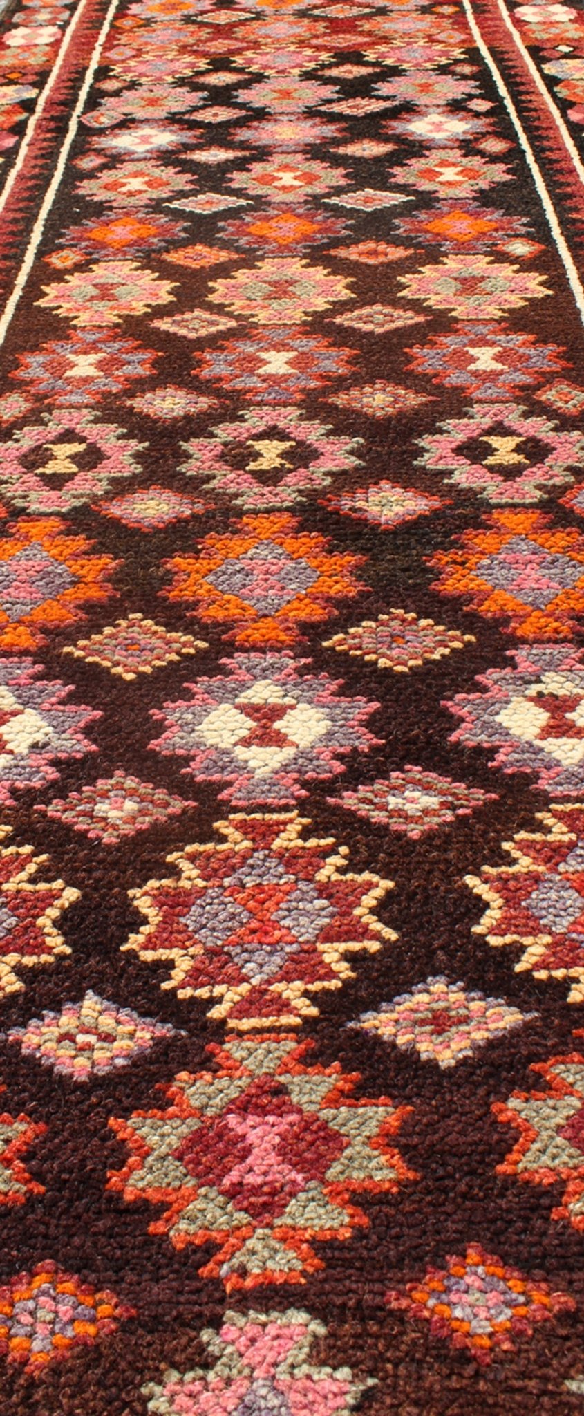 Black and Brown Background Colorful Vintage Turkish Runner with Geometric Design, rug en - 165383, country of origin / type: Turkey / Oushak, circa 1950 This vintage Turkish runner (circa mid - 20th century) features a unique blend of colors and an ... - Keivan Woven ArtsEN - 165383 - 9026Rug