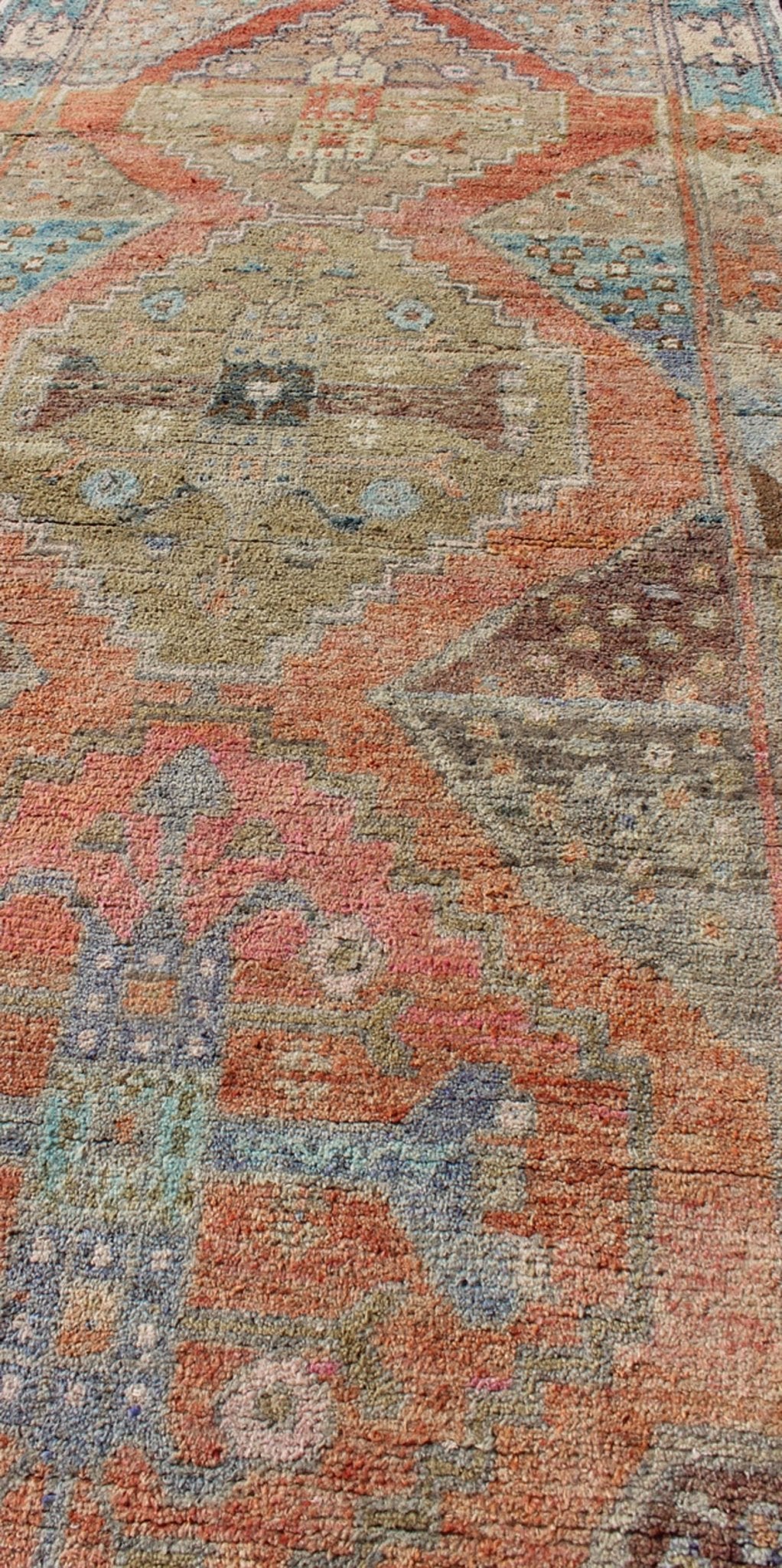 Antique Turkish Oushak Runner in Coral, Blue, Brown, Yellow Green & Rust Red Amazingly Beautiful antique Oushak runner with Geometric Medallion Design, rug EN - 165772 , country of origin / type: Turkey / Oushak, circa 1930 The painting li... - Keivan Woven ArtsEN - 165772 - 9496Rug