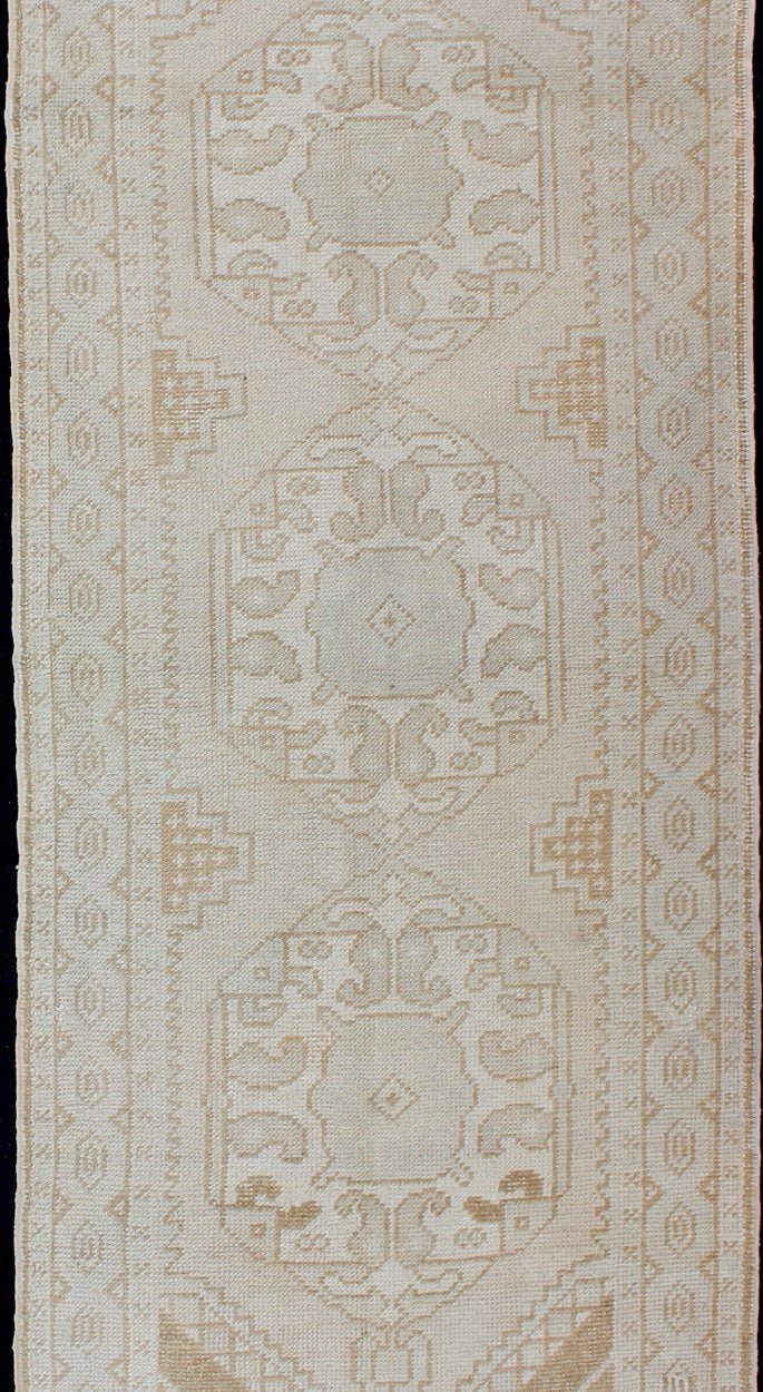 Subdued Vintage Turkish Oushak Runner with Medallions Lightly toned vintage Turkish Runner with Oushak design, Keivan Woven Arts / rug EN - 176032, country of origin / type: Turkey / Oushak, circa 1940. This vintage Turkish Oushak runner fe... - Keivan Woven ArtsEN - 176032 - 10233Rug