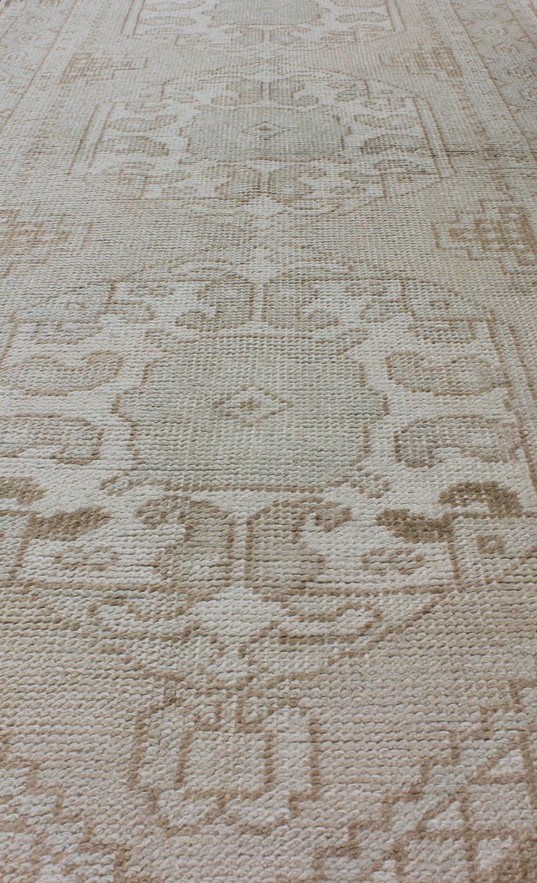 Subdued Vintage Turkish Oushak Runner with Medallions Lightly toned vintage Turkish Runner with Oushak design, Keivan Woven Arts / rug EN - 176032, country of origin / type: Turkey / Oushak, circa 1940. This vintage Turkish Oushak runner fe... - Keivan Woven ArtsEN - 176032 - 10233Rug