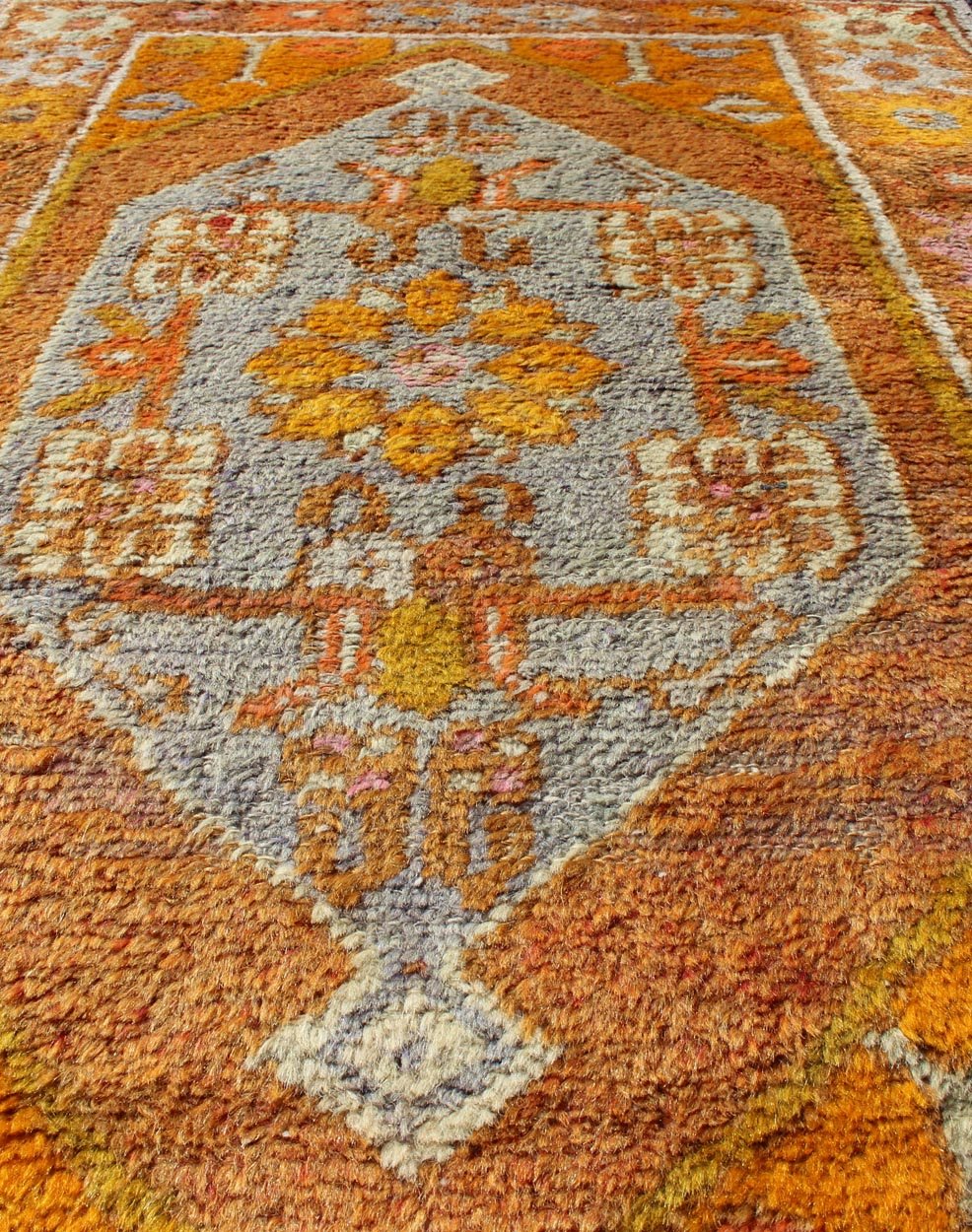 Vintage Turkish Oushak in Orange, Copper& Yellow Tones With Geometric Medallion. Vintage Turkish Oushak rug with geometric medallion, rug EN - 176568, country of origin / type: Turkey / Oushak, circa 1930 This Oushak runner features a uniq... - Keivan Woven ArtsEN - 176568 - 10688Rug