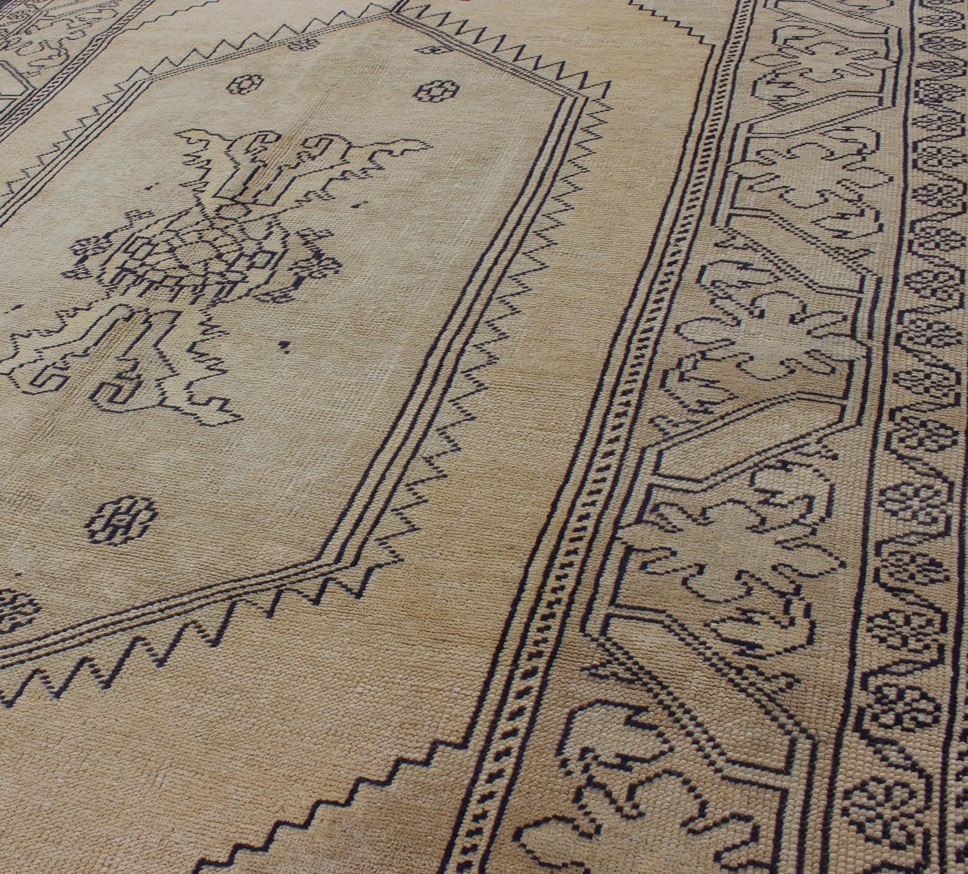 Vintage Cream and Charcoal Turkish Oushak Rug With Stylized Medallion Design Measures 5'0 x 8'7 This Turkish vintage Oushak rug, (circa 1940) features an intricately beautiful and highly stylized design. The central medallion is compleme... - Keivan Woven ArtsEN - 1781 - 5289Rug