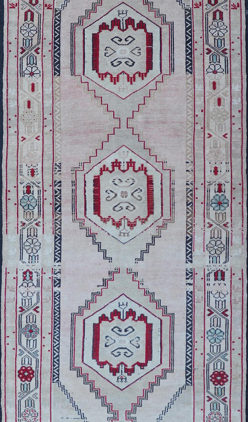 Vintage Turkish Oushak Runner with Medallions in Cream, dark blue, pink and Red. Keivan Woven Arts / rug EN - 178468, country of origin / type: Turkey / Oushak, circa 1940. Measures: 3'7 x 10'6 This Turkish Oushak runner features stylized ... - Keivan Woven ArtsEN - 178468 - 23631Rug