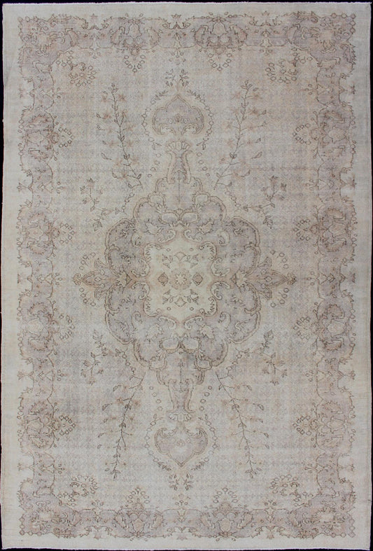 Keivan Woven Arts Vintage Turkish Distressed Rug in Sand, Cream, lavender, Taupe with brown highlights Measures:6'7 x 10'5 Sand, Taupe, cream and light lavender distressed vintage rug from Turkey with medallion design of etched motifs, ... - Keivan Woven ArtsEN - 179640 - 12627Rug