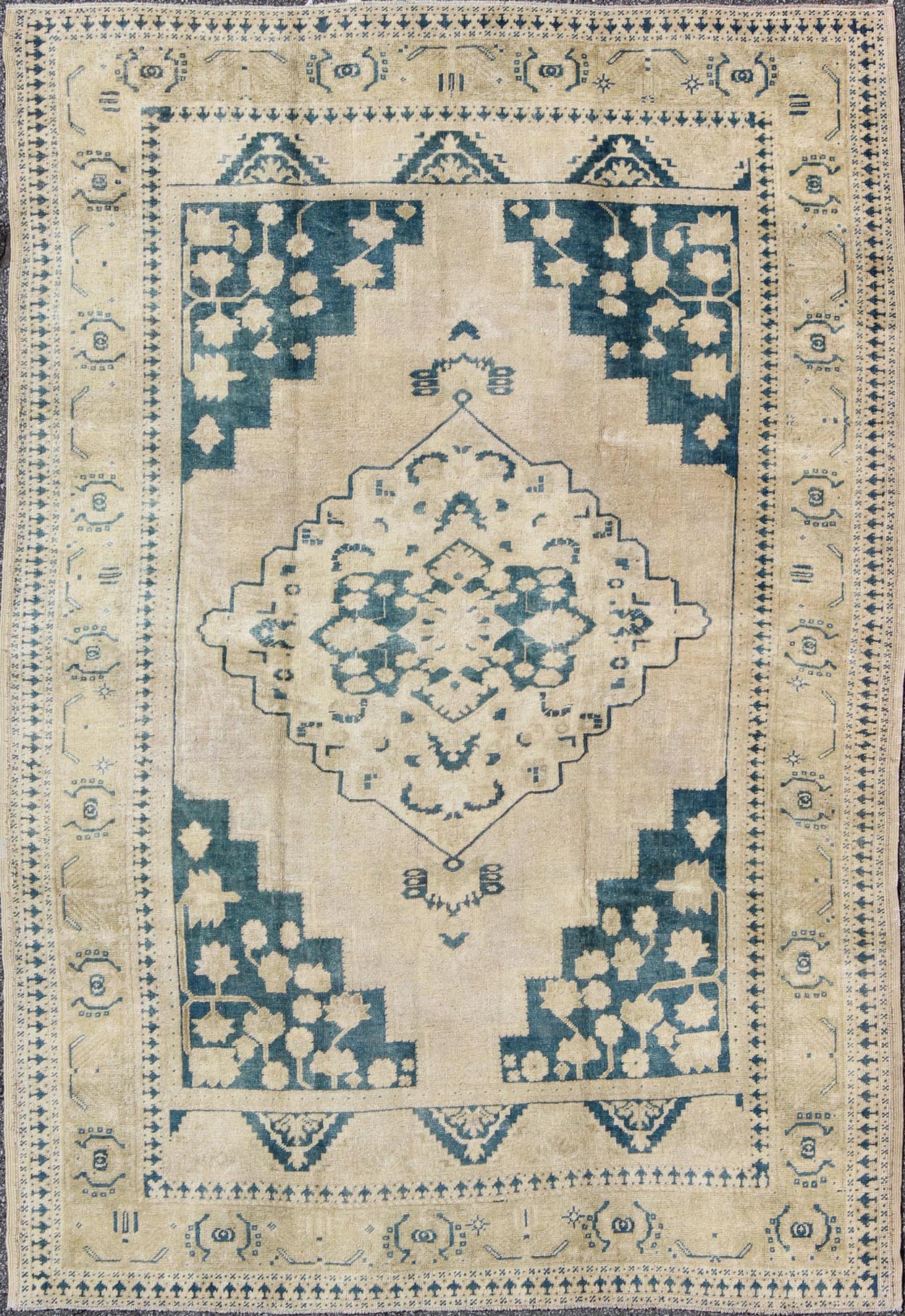 Turkish Oushak Rug This geometric Turkish Oushak carpet rests beautifully upon an ivory background with a cream border. A blue outlined medallion takes center stage and is well balanced by four organic corner motifs composed of the same blue and... - Keivan Woven ArtsEN - 240 - 3064Rug
