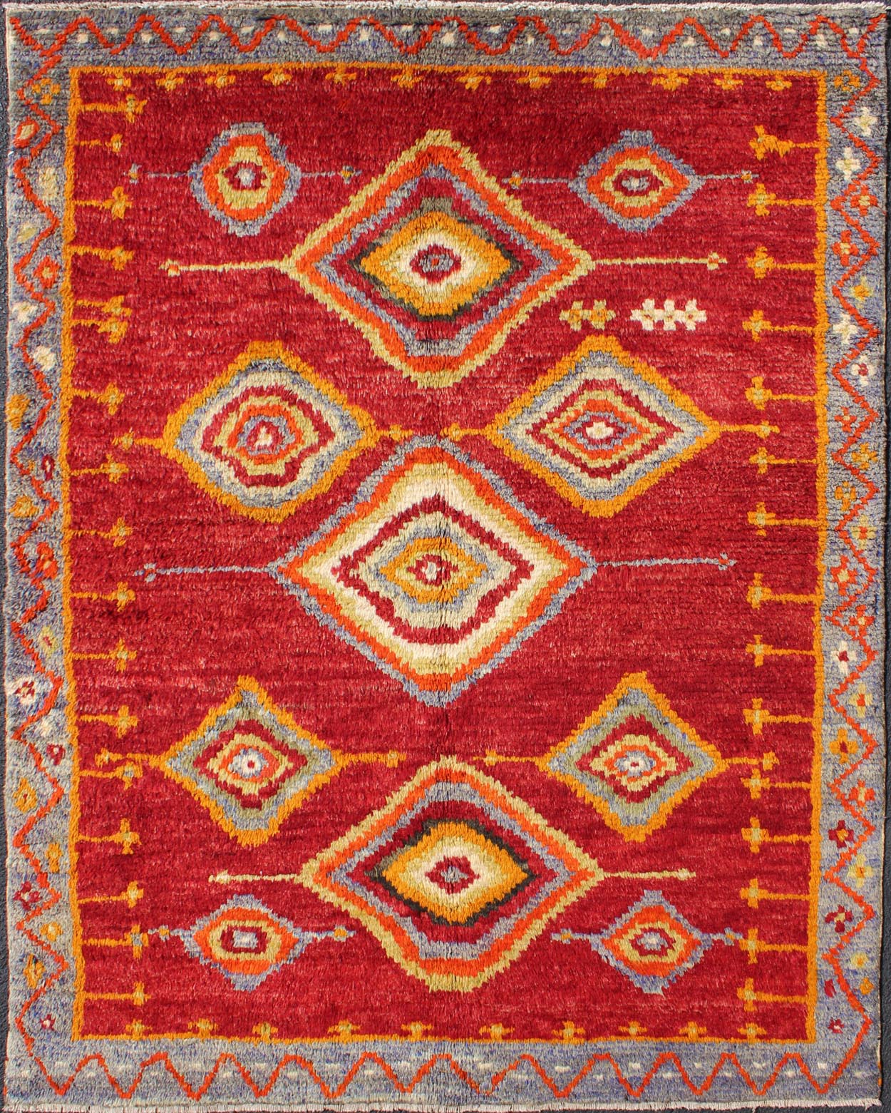 Tribal Turkish Konya Rug With Diamond Design in Beautiful Royal Red Background This brilliant Tribal Konya rug showcases a multi - layered diamond pattern with a range of green, orange, yellow and blue that glow in the bright red field. A light gr... - Keivan Woven ArtsEN - 3270 - 5456Rug