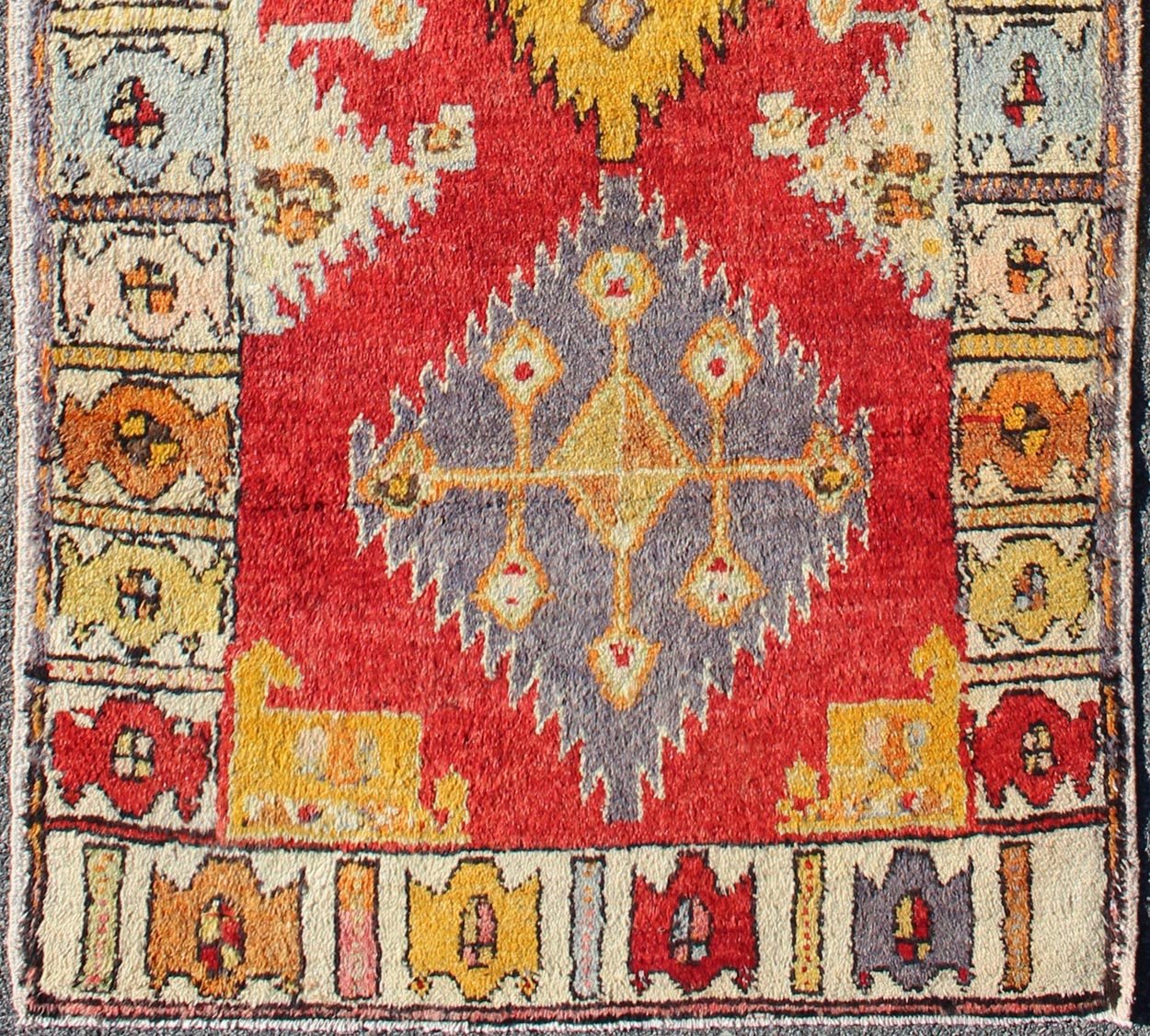 Tribal Turkish Oushak Runner This cheerful Oushak runner contains a unique blend of colors along with geometric design. The multi - layered diamond medallions are complemented by asymmetrical and tribal motifs. The various shades of yellow, gold, ... - Keivan Woven ArtsEN - 3308 - 5498Rug