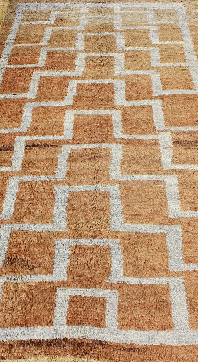 This vintage Tulu from mid - 20th century Turkey boasts an interconnected tribal pattern. The multi - tiered pattern consists of ivory outlines set on a light orange field. The contrast of color adds a particular depth to accentuate the unique style of thi... - Keivan Woven ArtsEN - 3313 - 5514Rug