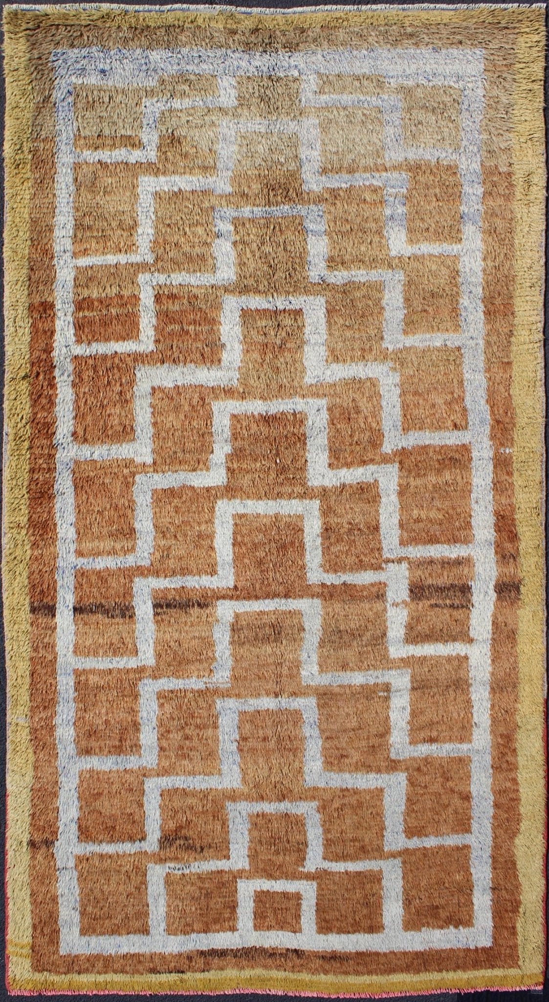 This vintage Tulu from mid - 20th century Turkey boasts an interconnected tribal pattern. The multi - tiered pattern consists of ivory outlines set on a light orange field. The contrast of color adds a particular depth to accentuate the unique style of thi... - Keivan Woven ArtsEN - 3313 - 5514Rug