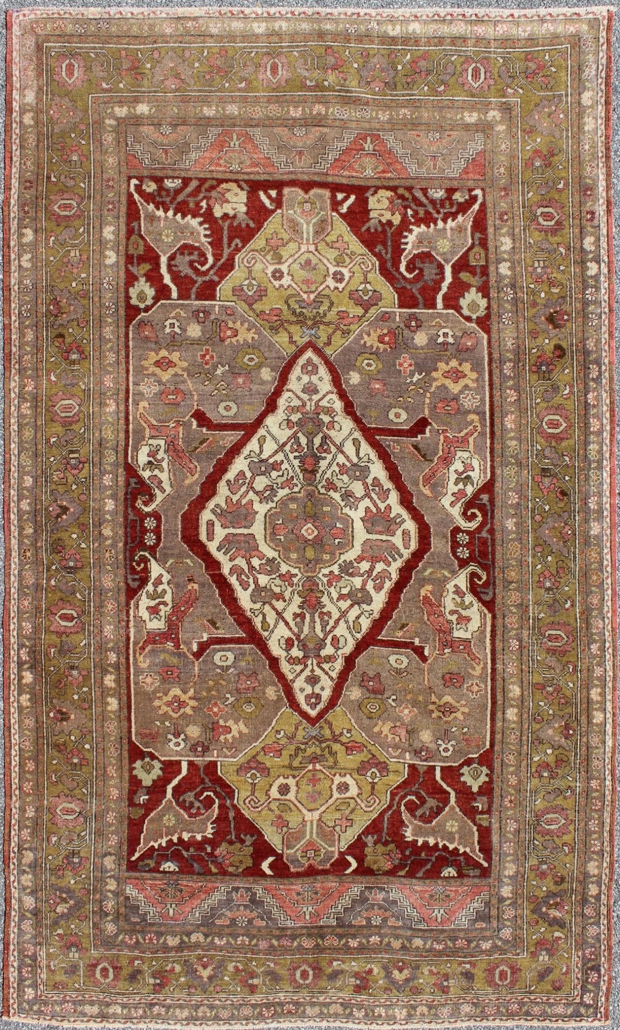 Turkish Oushak Reproduction Rug with Geometric Motifs in Green. rug/ - en - 3451 origin/turkey kwarugs This unique, vintage Turkish Oushak rug features a unique blend of colors and an intricately beautiful design. The central medallion is complement... - Keivan Woven ArtsEN - 3451 - 4402Rug