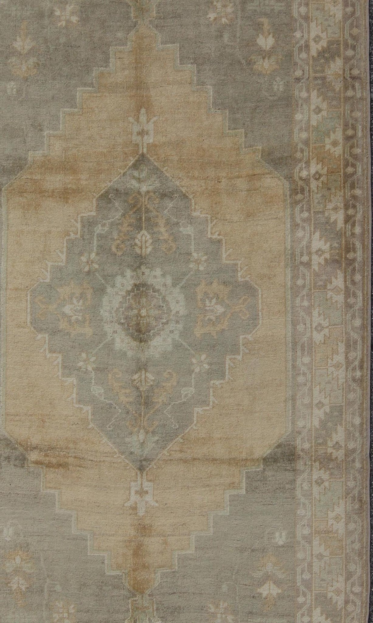 Muted Mid - 20th Century Vintage Oushak Rug with Medallion in Camel Measures: 5'5 x 9'4 This muted Turkish Oushak rests beautifully on a grounded camel - colored field. An understated medallion is well - balanced by four organic corner motifs, ... - Keivan Woven ArtsEN - 721 - 9236Rug
