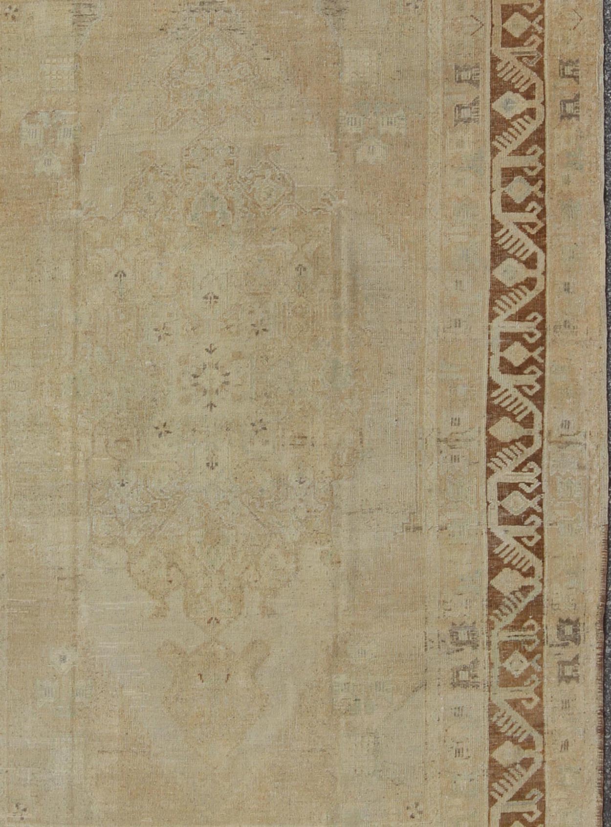 Vintage Turkish Diamond Medallion Oushak in Neutral Earth Tones Measures: 5'8 x 9'1 Characterized by a comely and highly representative Oushak composition, this vintage Oushak carpet beautifully communicates the finer strength of Oushak r... - Keivan Woven ArtsEN - 946 - 7821Rug
