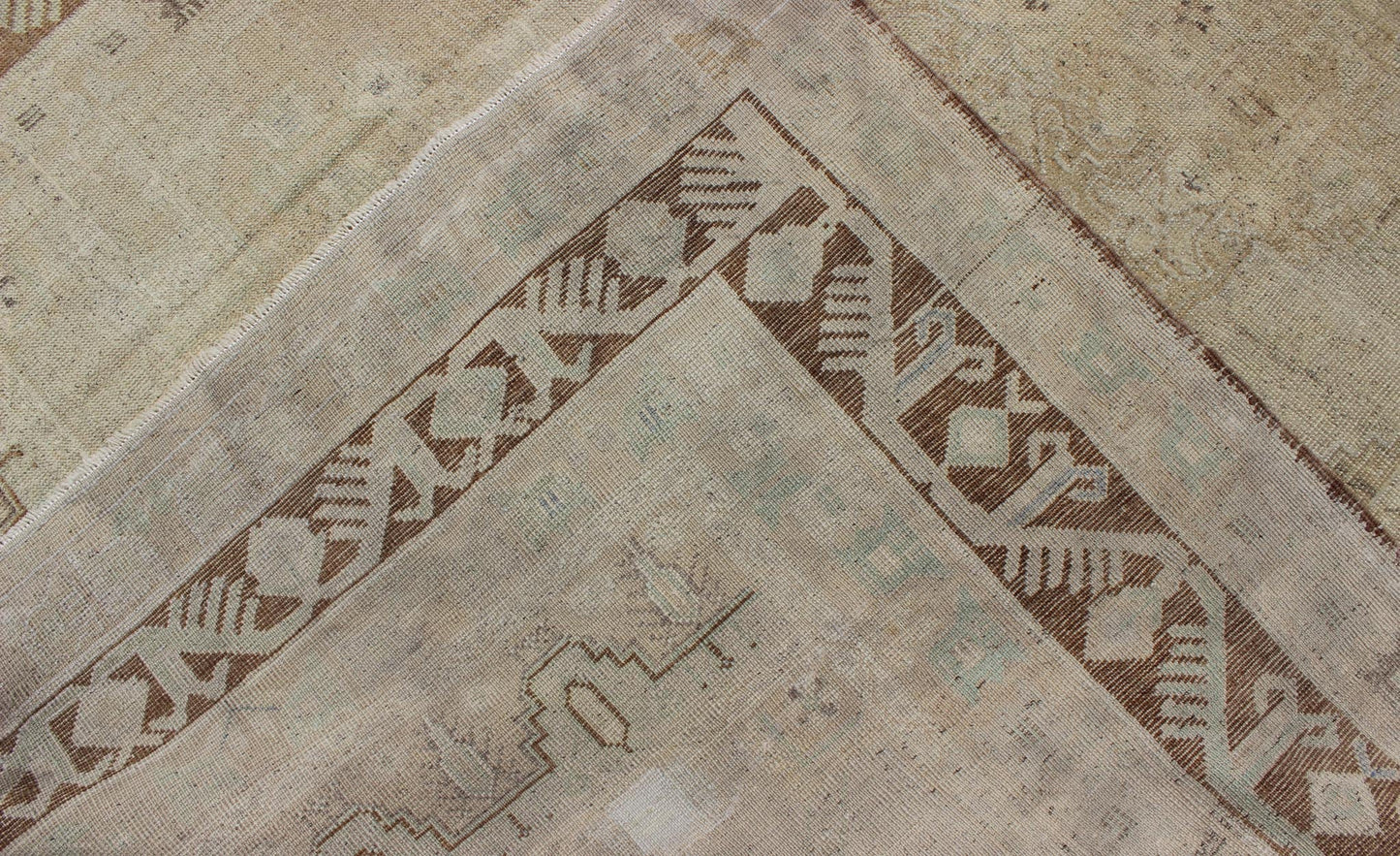 Vintage Turkish Diamond Medallion Oushak in Neutral Earth Tones Measures: 5'8 x 9'1 Characterized by a comely and highly representative Oushak composition, this vintage Oushak carpet beautifully communicates the finer strength of Oushak r... - Keivan Woven ArtsEN - 946 - 7821Rug