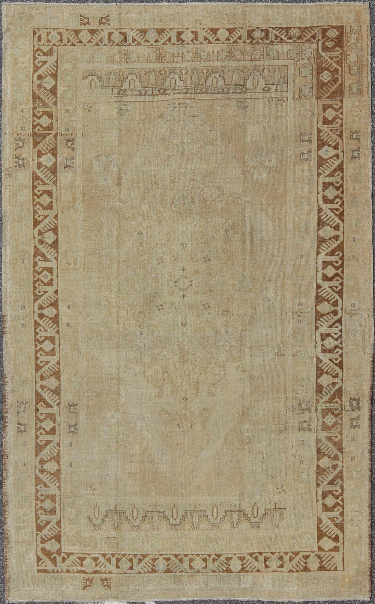 Vintage Turkish Diamond Medallion Oushak in Neutral Earth Tones Measures: 5'8 x 9'1 Characterized by a comely and highly representative Oushak composition, this vintage Oushak carpet beautifully communicates the finer strength of Oushak r... - Keivan Woven ArtsEN - 946 - 7821Rug