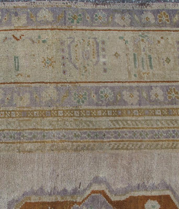 Vintage Turkish Oushak Rug in Brown, Pale Green, Taupe & Taupe Light Purple Measures 6'10 x 10'5 This softly colored Oushak carpet rests beautifully upon a field of elegant light taupe. A large medallion of lavender/gray and saddle brow... - Keivan Woven ArtsEN - 989 - 5265Rug
