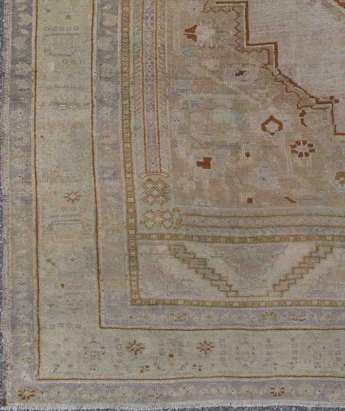 Vintage Turkish Oushak Rug in Brown, Pale Green, Taupe & Taupe Light Purple Measures 6'10 x 10'5 This softly colored Oushak carpet rests beautifully upon a field of elegant light taupe. A large medallion of lavender/gray and saddle brow... - Keivan Woven ArtsEN - 989 - 5265Rug