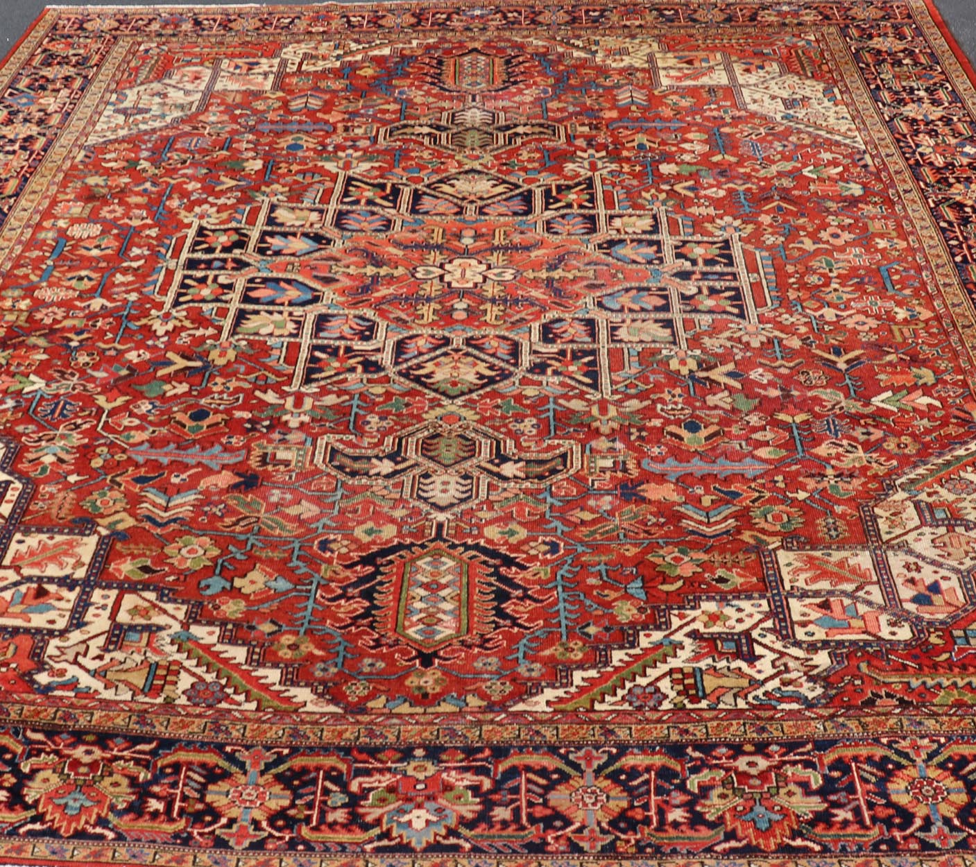 Antique Persian Heriz - Serapi Rug in Rust Background. kwarugs F - 1101. Large Heriz in Square shaped This superb antique Heriz - Serapi carpet, with its highly stylized central medallion and impressive geometric motifs, beautifully illustrates the gr... - Keivan Woven ArtsF - 1101 - 403Rug