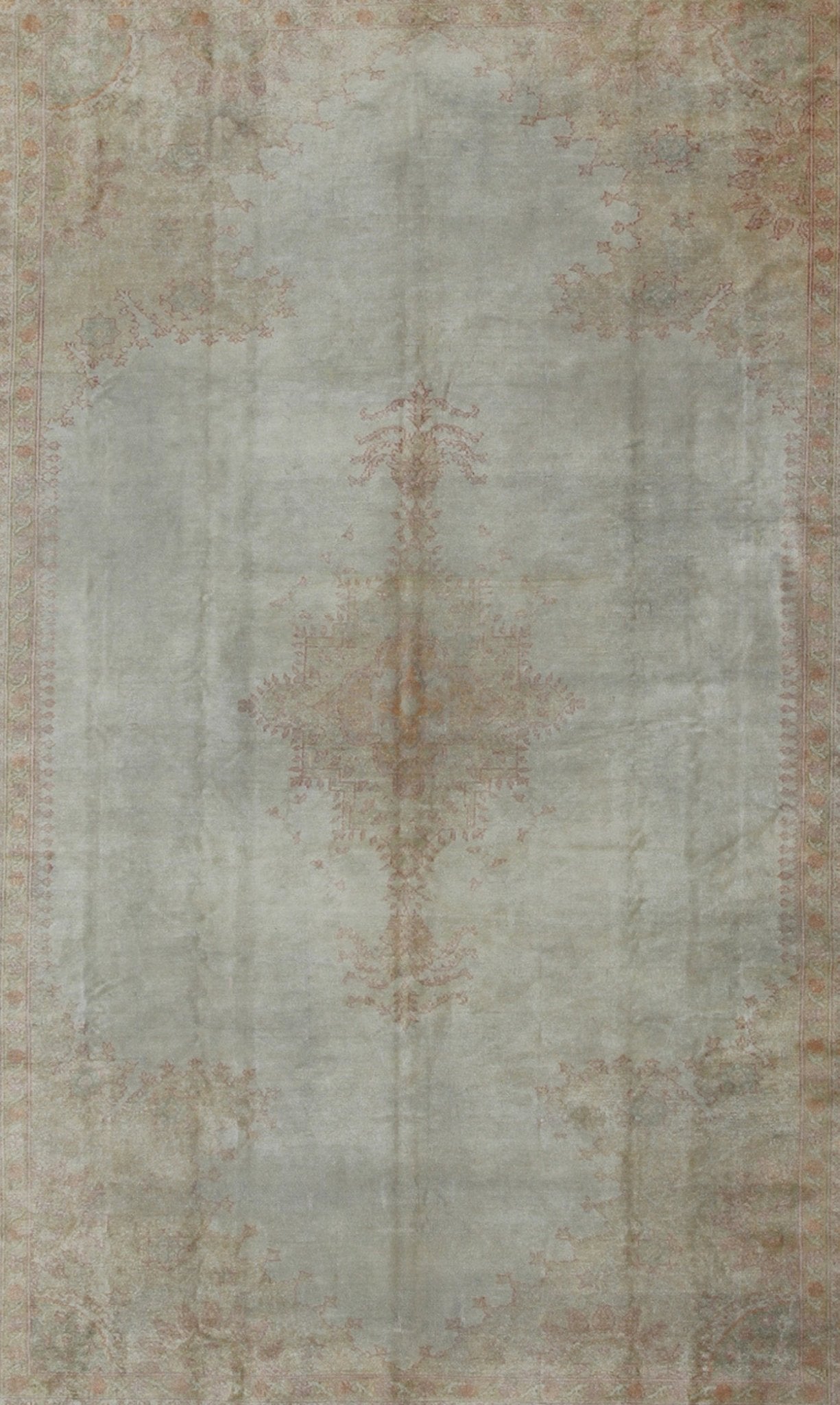 Antique Turkish Oushak This stunning antique Turkish Oushak from the late 19th Century bears a remarkably sophisticated palette of soft colors such as taupe, silver, mocha and cream. The floral designs of the border and cornices reach inward to ... - Keivan Woven ArtsG - 0703 - 1710Rug